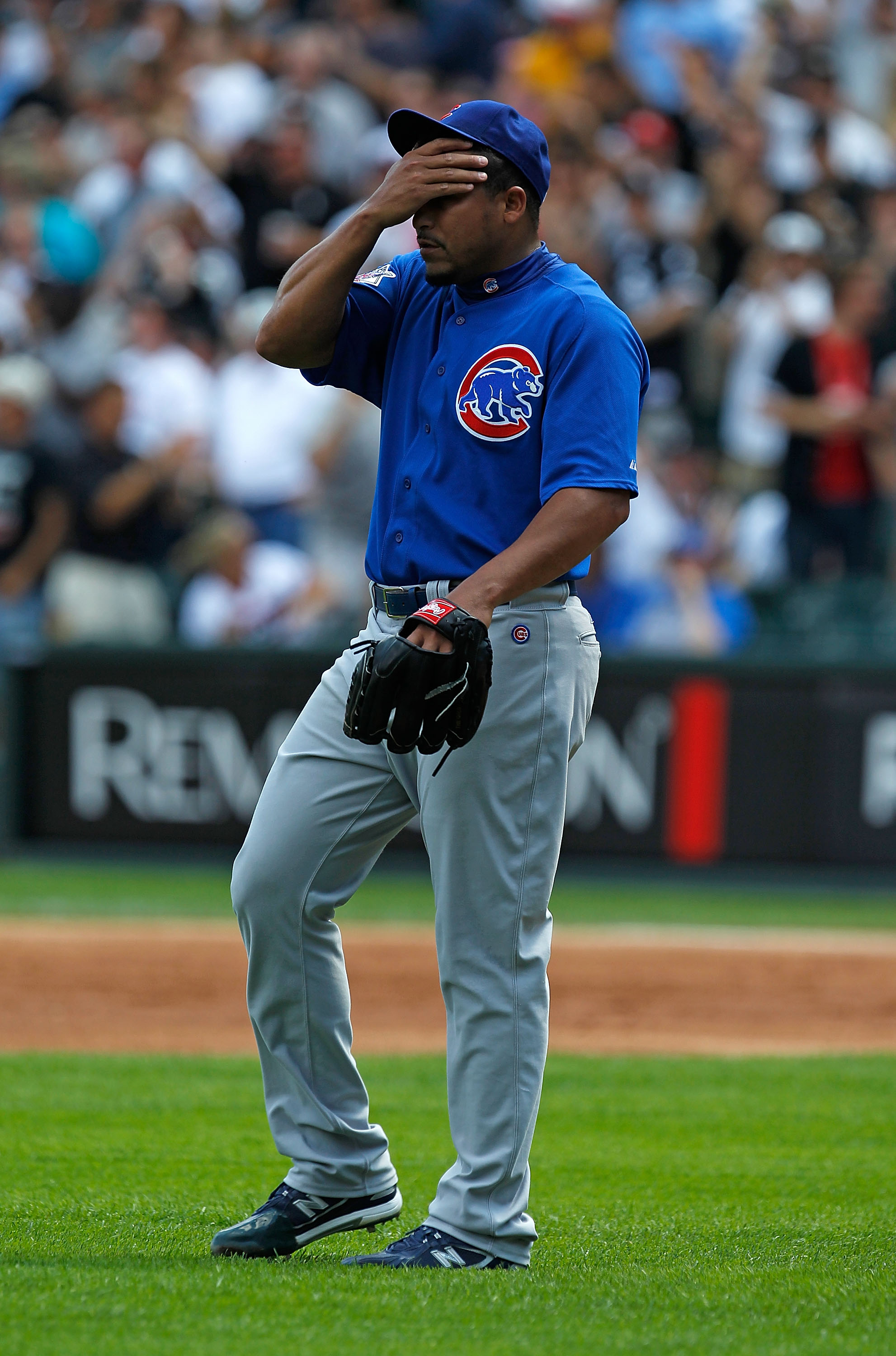 CHICAGO - JUNE 25: Starting pitcher Carlos Zambrano #38 of the Chicago Cubs reacts after giving up a three-run home run in the 1st inning to Carlos Quentin of the Chicago White Sox at U.S. Cellular Field on June 25, 2010 in Chicago, Illinois.  Zambrano wa