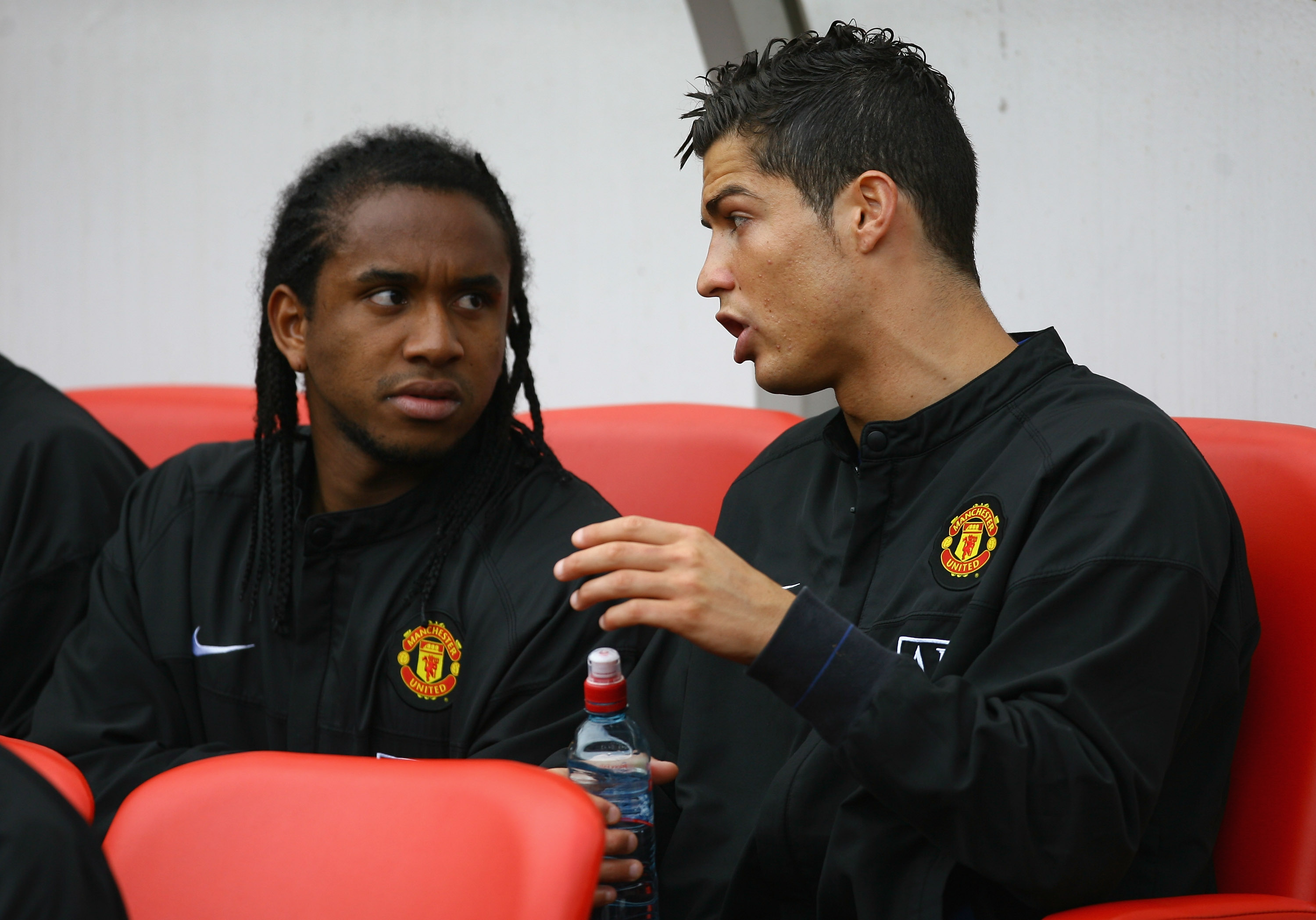 SUNDERLAND, UNITED KINGDOM - APRIL 11: Cristiano Ronaldo (R) of Manchester United chats with team mate Anderson as they sit on the bench prior to the Barclays Premier League match between Sunderland and Manchester United at The Stadium of Light on April 1