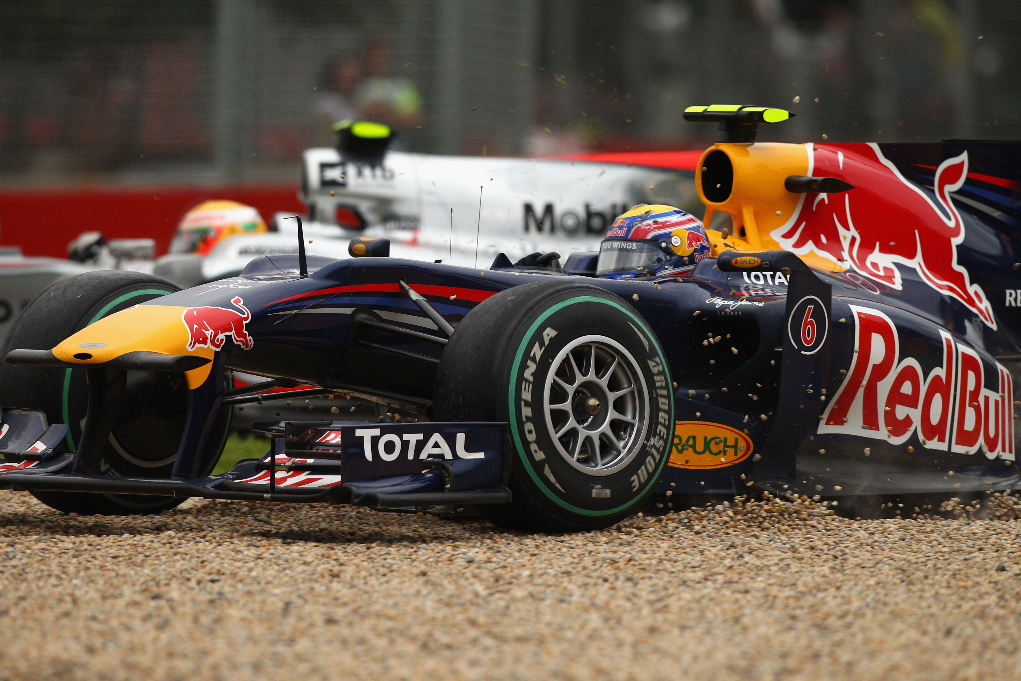 Webber in the gravel after clipping Hamilton