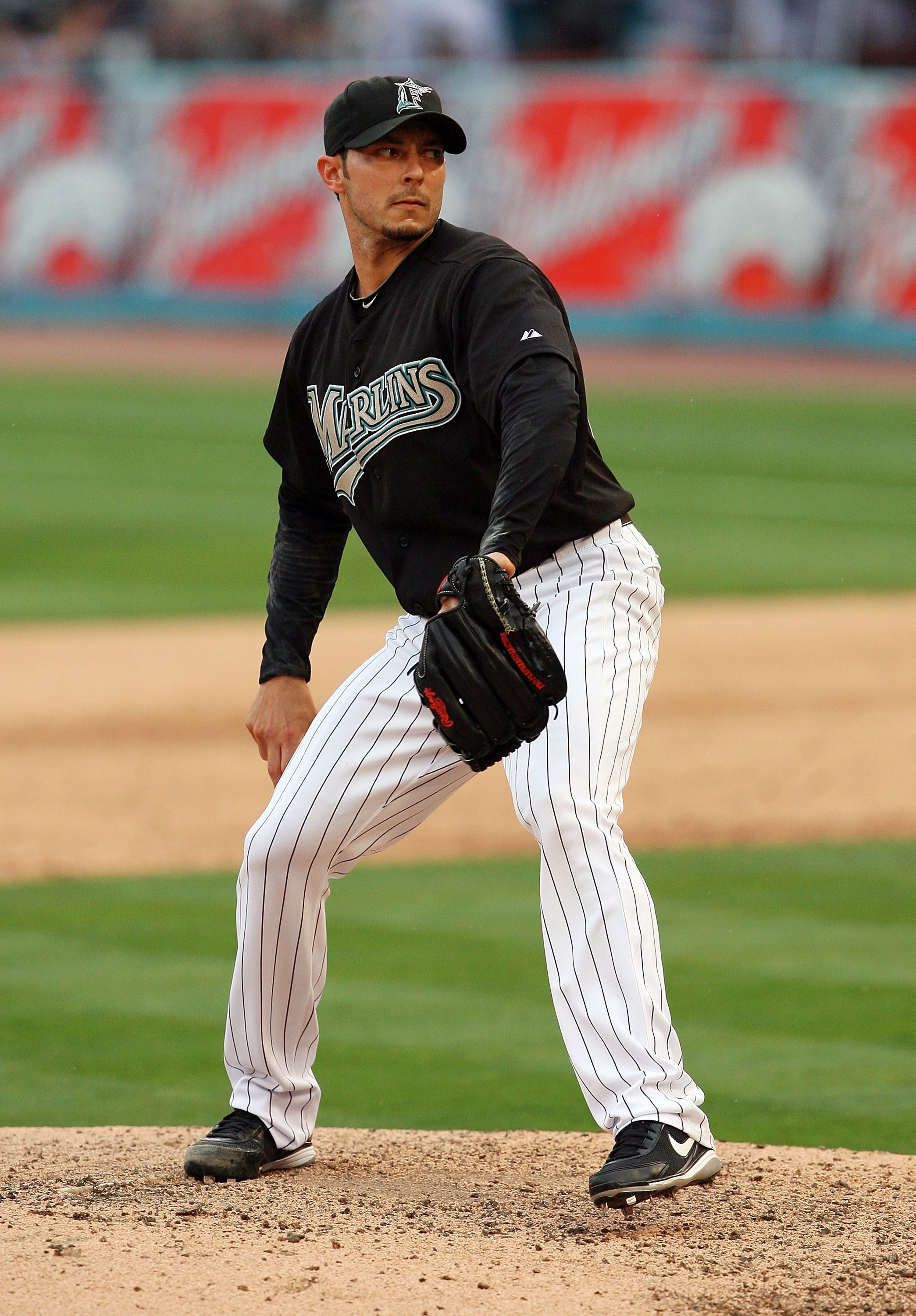 Miami Marlins catcher Miguel Olivo, right, talks to relief pitcher