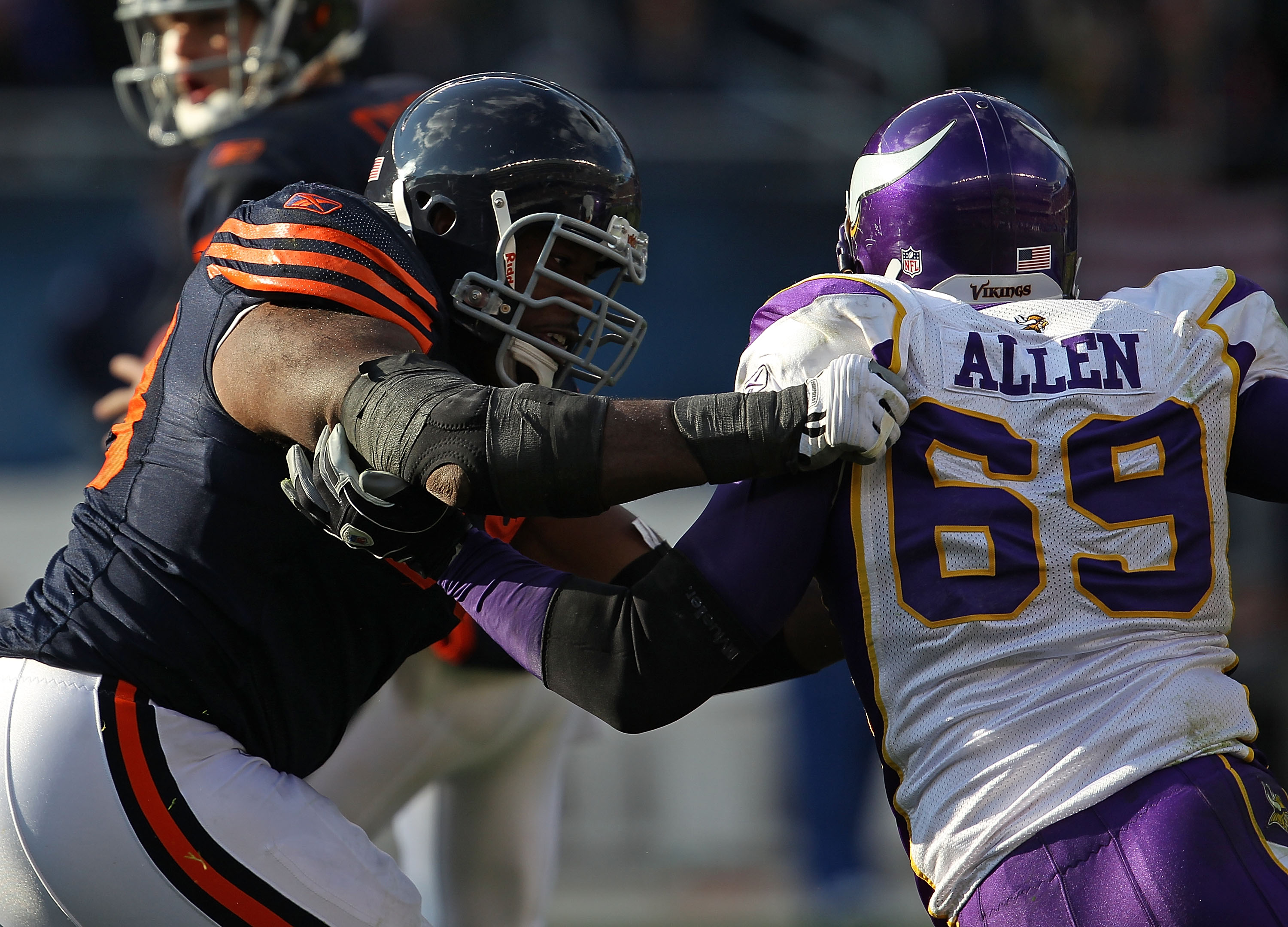 CHICAGO - NOVEMBER 14: Frank Omiyale #68 of the Chicago Bears grabs Jared Allen #69 of the Minnesota Vikings at Soldier Field on November 14, 2010 in Chicago, Illinois. The Bears defeated the Vikings 27-13. (Photo by Jonathan Daniel/Getty Images)