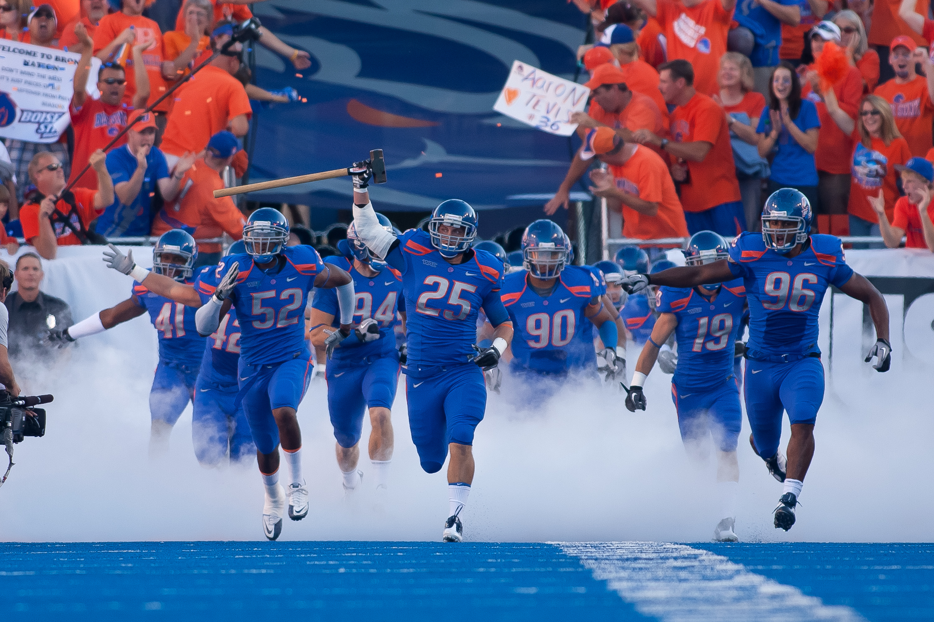 BOISE, ID - SEPTEMBER 25:  Linebacker Billy Derome #25 of the Boise State Broncos leads his team onto the field before the game against the Oregon State Beavers at Bronco Stadium on September 25, 2010 in Boise, Idaho.  (Photo by Otto Kitsinger III/Getty I
