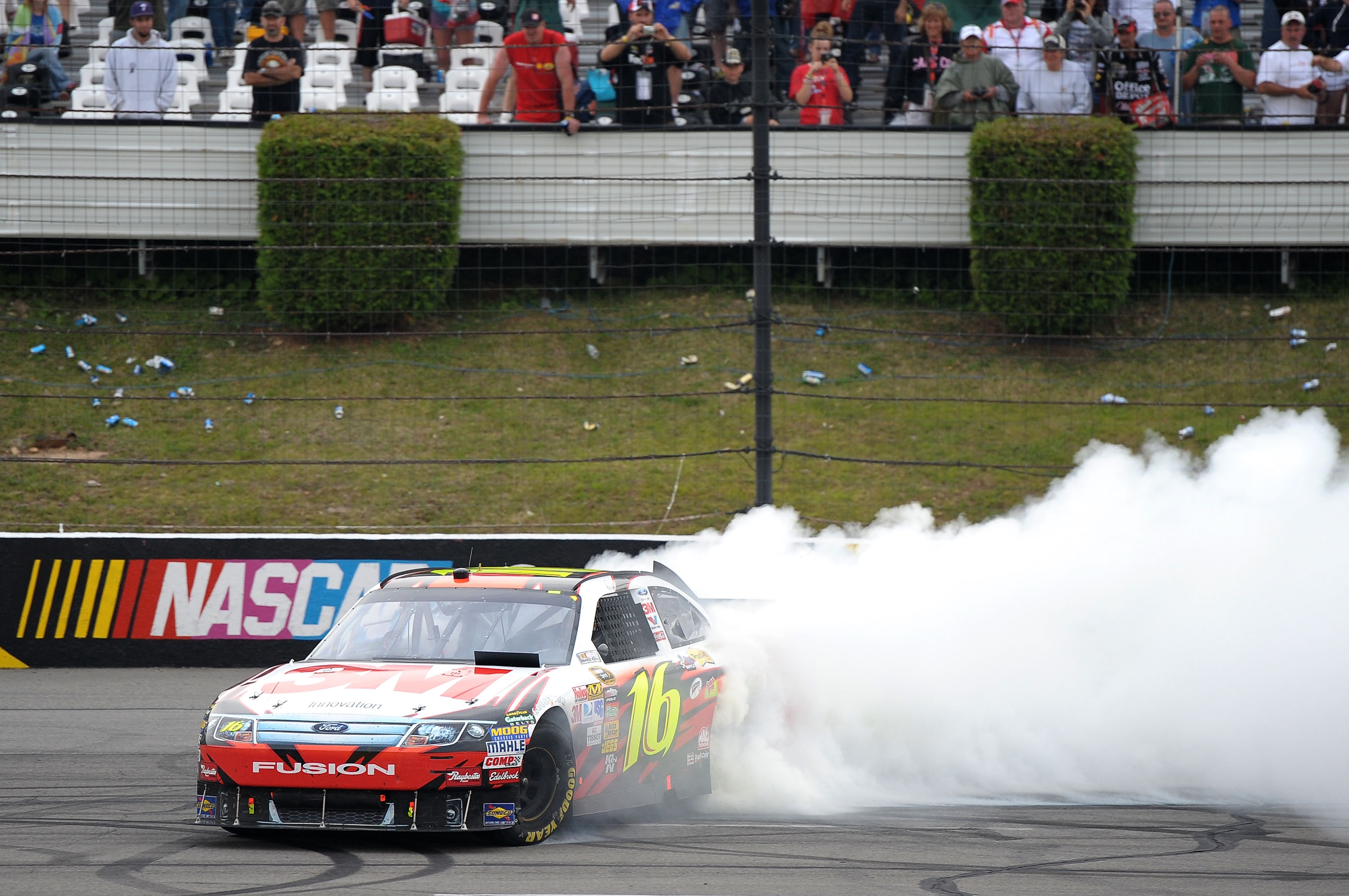 LONG POND, PA - AUGUST 01:  Greg Biffle, driver of the #16 3M Ford, performs a burnout after winning the NASCAR Sprint Cup Series Sunoco Red Cross Pennsylvania 500 at Pocono Raceway on August 1, 2010 in Long Pond, Pennsylvania.  (Photo by Drew Hallowell/G