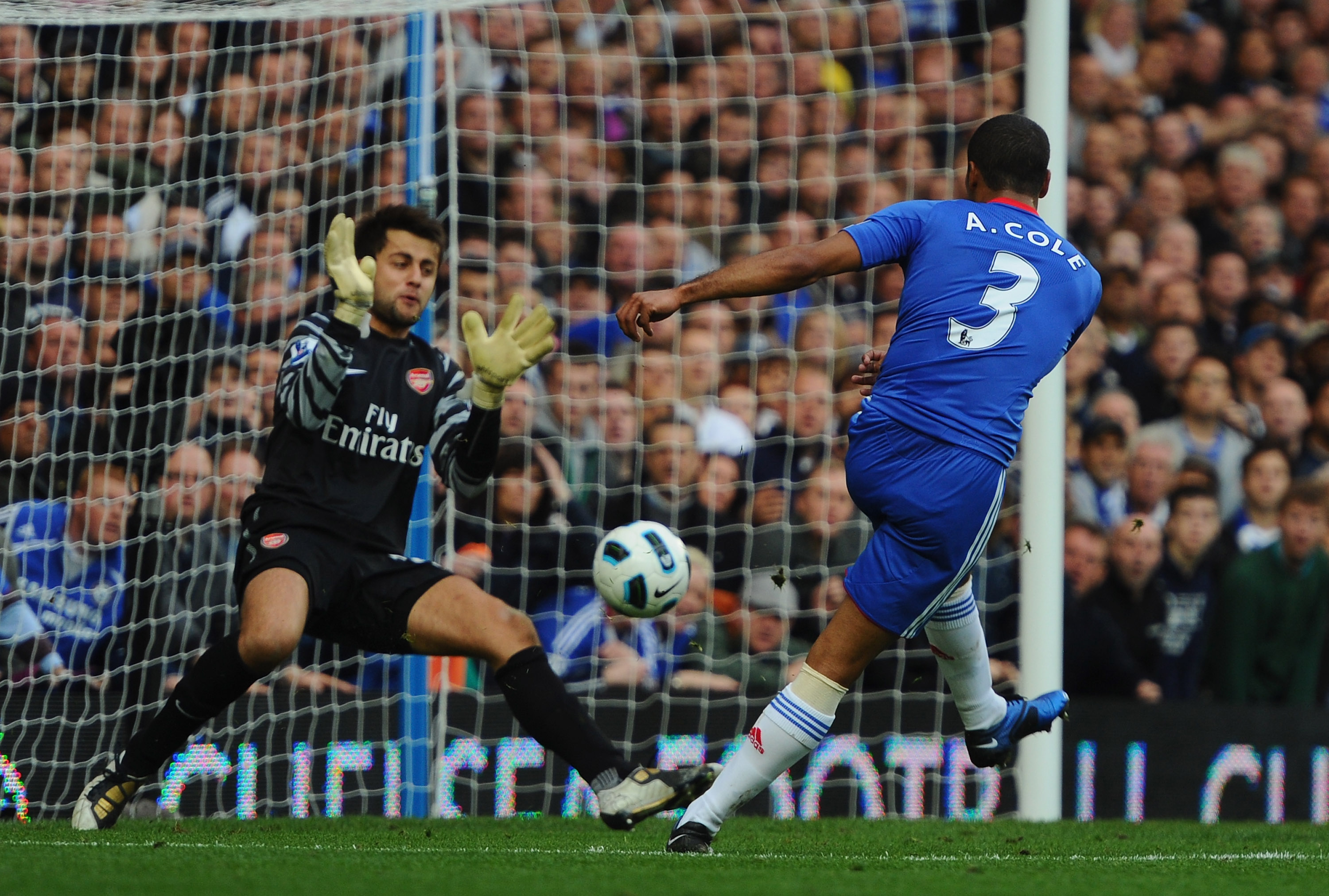 LONDON, ENGLAND - OCTOBER 03:  Ashley Cole of Chelsea shoots past Lukasz Fabianski of Arsenal but sees his 'goal' disallowed for offside during the Barclays Premier League match between Chelsea and Arsenal at Stamford Bridge on October 3, 2010 in London,