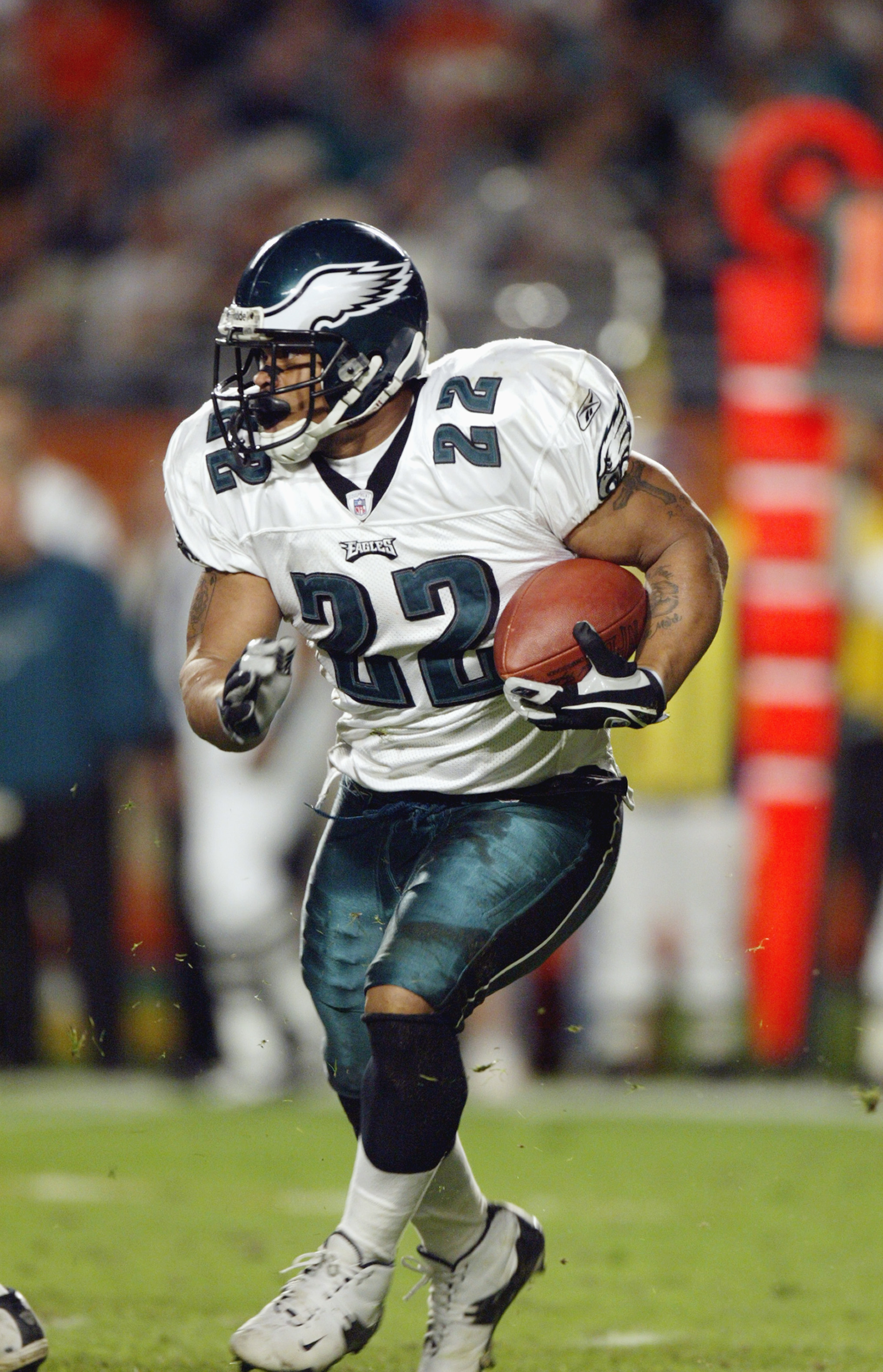 MIAMI - DECEMBER 15:  Running back Duce Staley #22 of the Philadelphia Eagles runs for a first down against the Miami Dolphins on December 15, 2003 at Pro Player Stadium in Miami, Florida.  The Eagles defeated the Dolphins 34-27.  (Photo by Eliot J. Schec