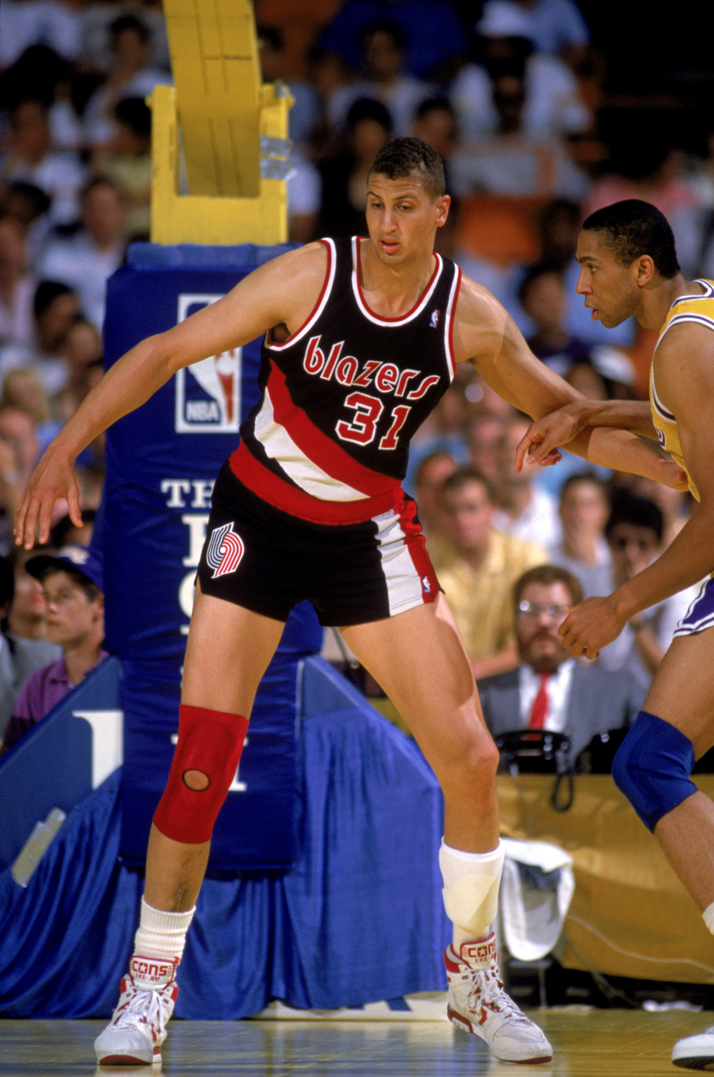 INGLEWOOD, CA - 1989:  Sam Bowie #31 of the Portland Trail Blazers battles for position during a game in the 1988-89 NBA season against the Los Angeles Lakers at the Great Western Forum in Inglewood, California.  (Photo by Stephen Dunn/Getty Images)