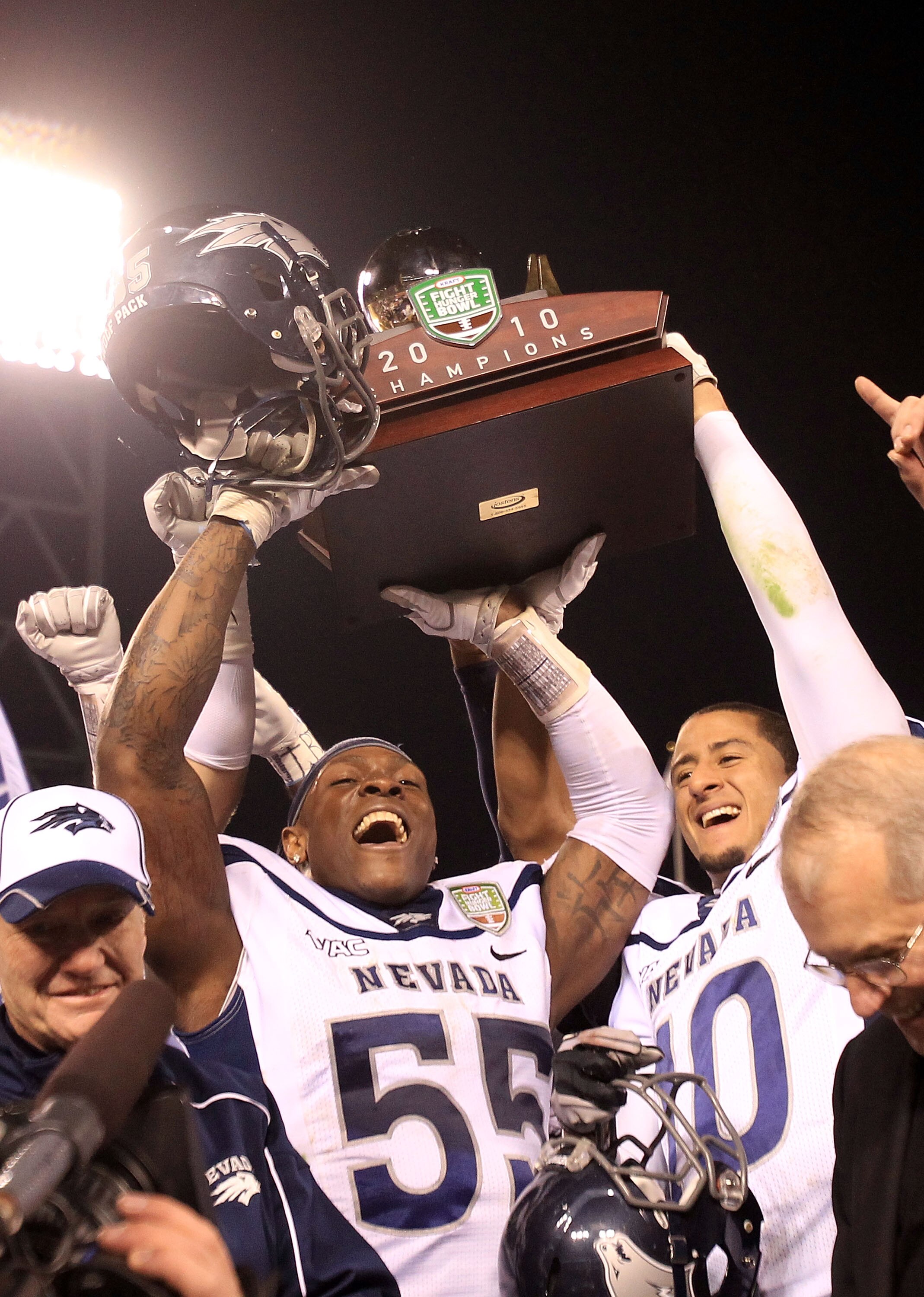SAN FRANCISCO, CA - JANUARY 09:  Dontay Moch #55 and Colin Kaepernick #10 of the Nevada Wolf Pack hold up the trophy after they beat Boston College in the Kraft Fight Hunger Bowl at AT&T Park on January 9, 2011 in San Francisco, California.  (Photo by Ezr