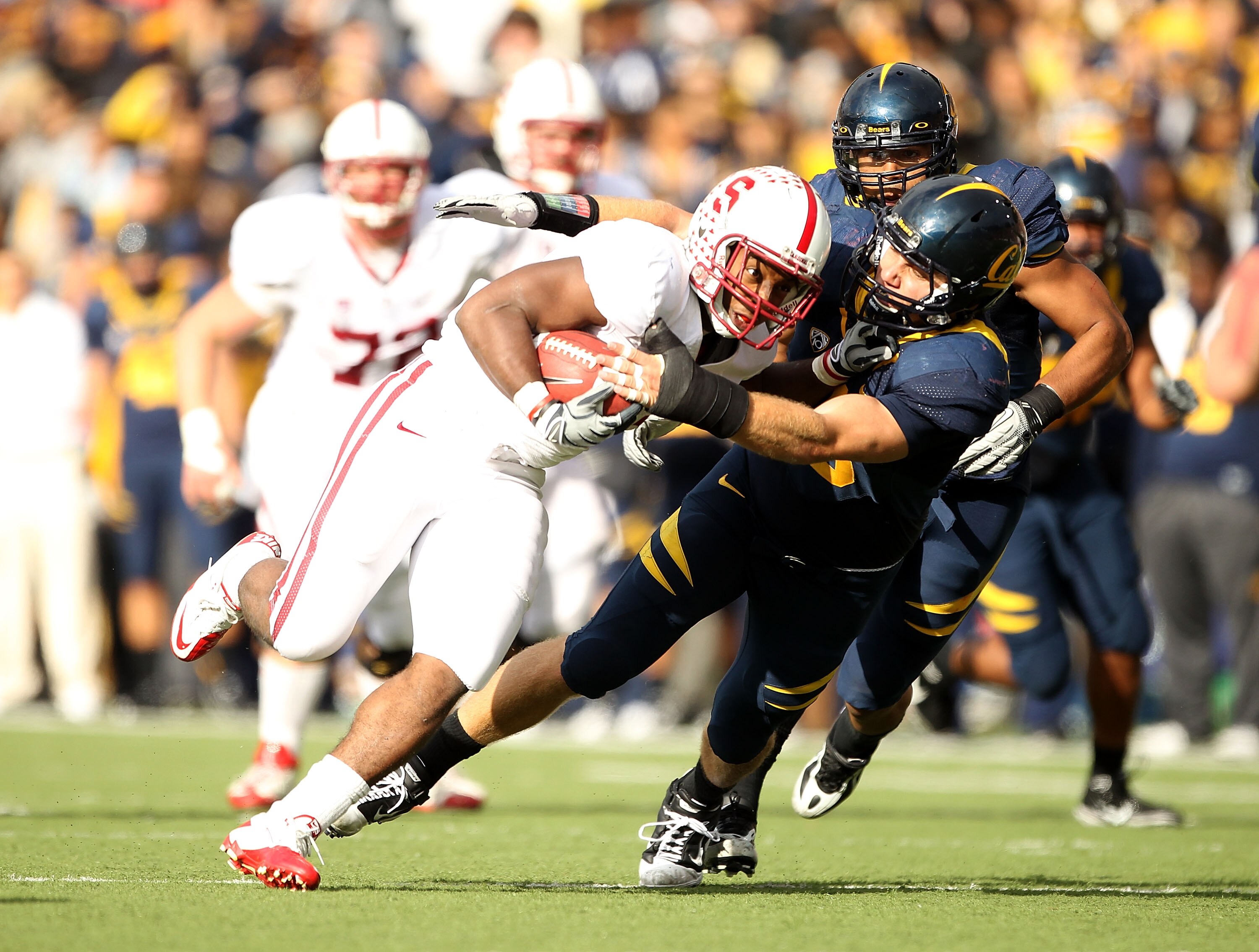 BERKELEY, CA - NOVEMBER 20:  Stepfan Taylor #33 of the Stanford Cardinal is tackled by Mike Mohamed #18 of the California Golden Bears at California Memorial Stadium on November 20, 2010 in Berkeley, California.  (Photo by Ezra Shaw/Getty Images)