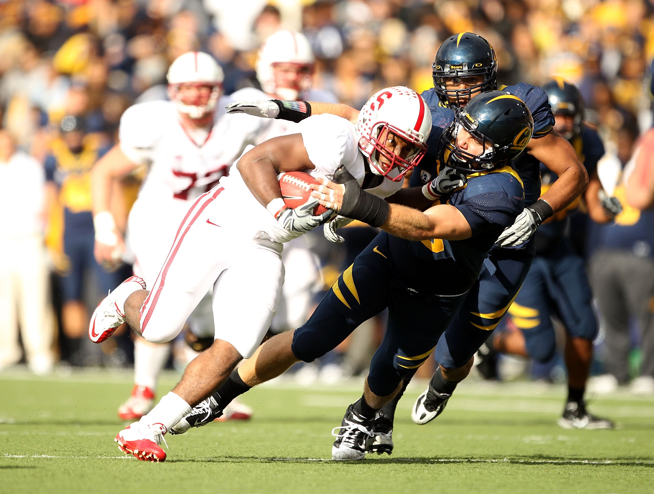 BERKELEY, CA - NOVEMBER 20:  Stepfan Taylor #33 of the Stanford Cardinal is tackled by Mike Mohamed #18 of the California Golden Bears at California Memorial Stadium on November 20, 2010 in Berkeley, California.  (Photo by Ezra Shaw/Getty Images)