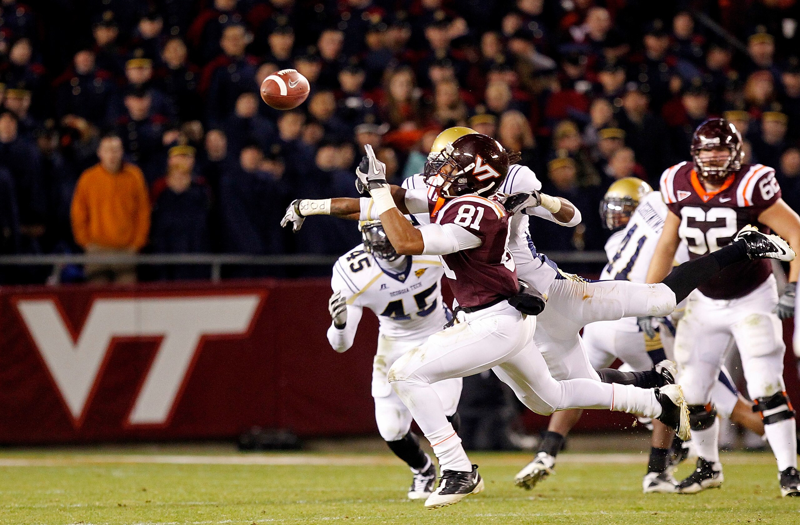 BLACKSBURG, VA - NOVEMBER 04: Wide receiver Jarrett Boykin #81 of the Virginia Tech Hokies tries to catch the ball as cornerback Mario Butler #2 of the Georgia Tech Yellow Jackets defends at Lane Stadium on November 4, 2010 in Blacksburg, Virginia.  (Phot