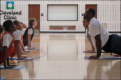 LBJ practicing yoga and really helping young kids.