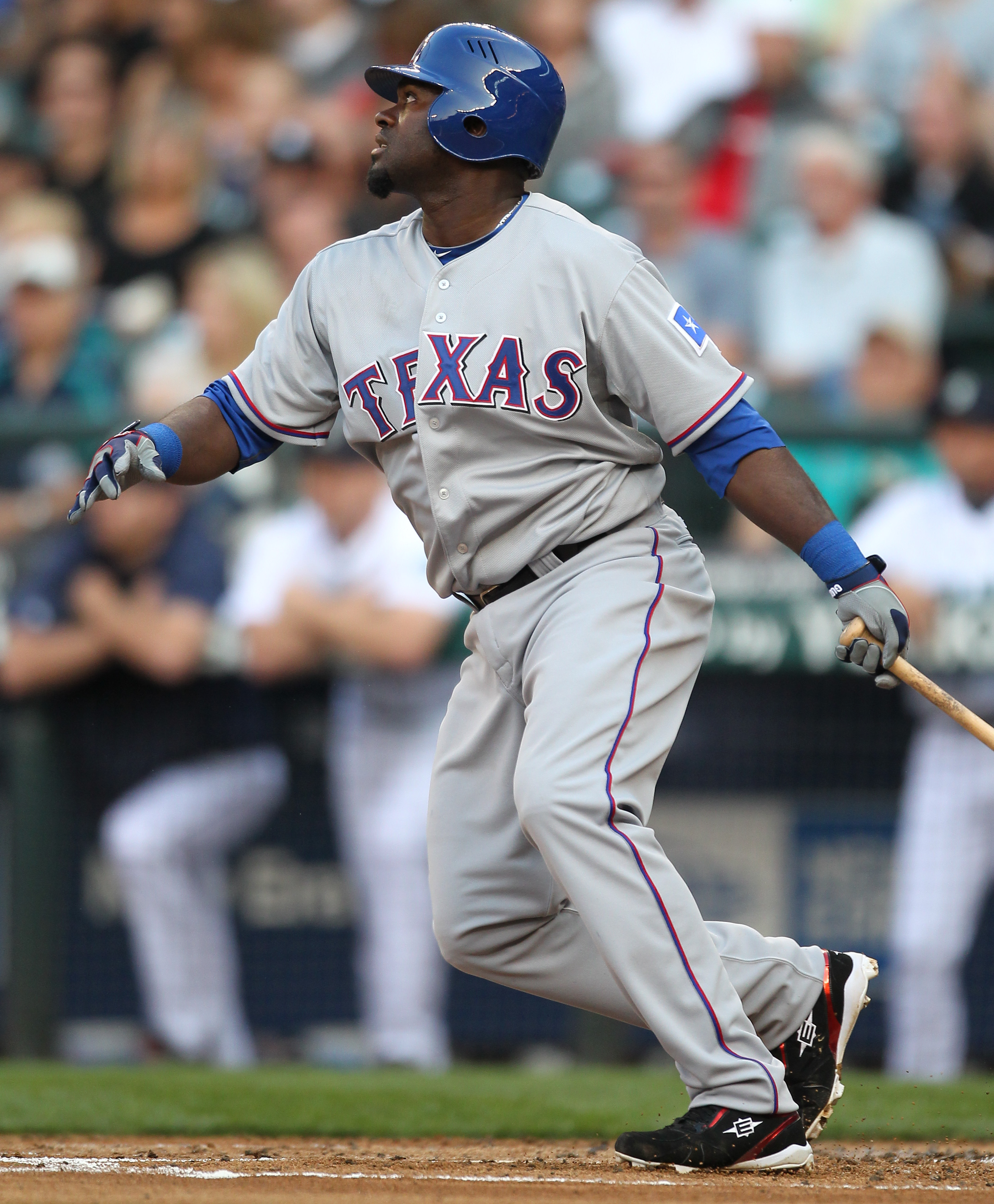 SEATTLE - AUGUST 03:  Cristian Guzman #12 of the Texas Rangers bats against the Seattle Mariners at Safeco Field on August 3, 2010 in Seattle, Washington. (Photo by Otto Greule Jr/Getty Images)