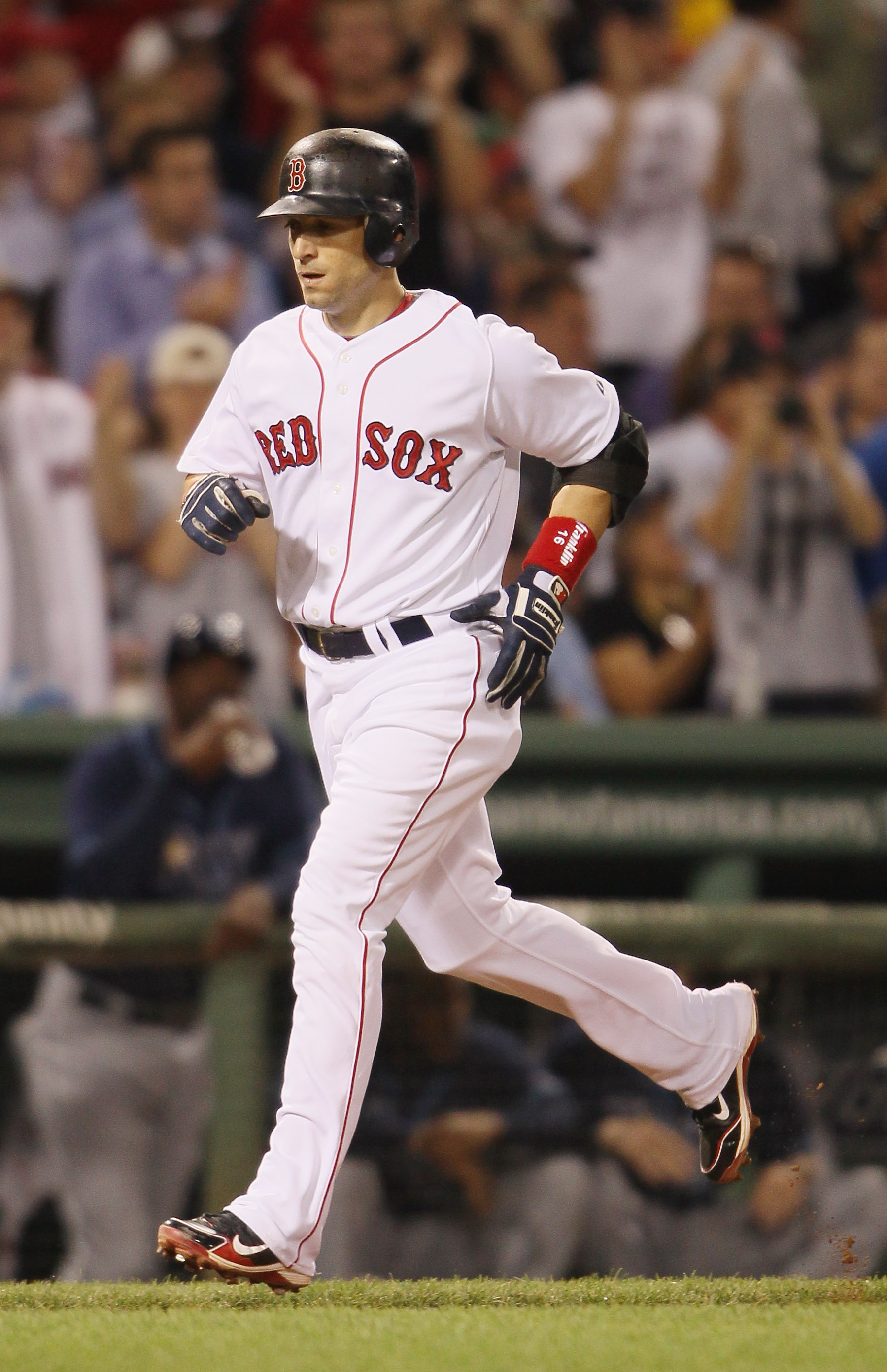 BOSTON - SEPTEMBER 08:  Marco Scutaro #16 of the Boston Red Sox heads for home after he hit a solo home run against the Tampa Bay Rays on September 8, 2010 at Fenway Park in Boston, Massachusetts.  (Photo by Elsa/Getty Images)