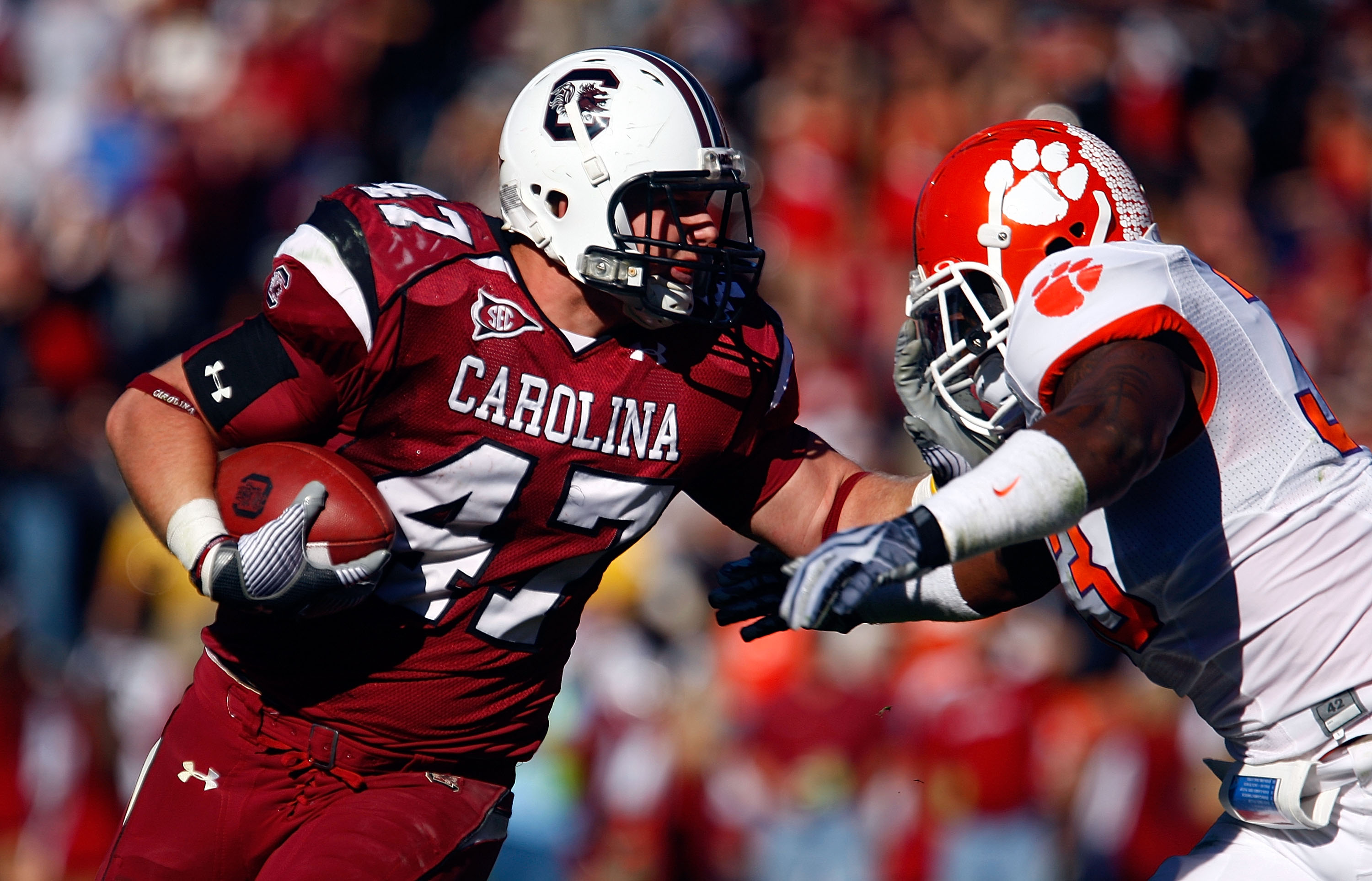 COLUMBIA, SC - NOVEMBER 28:  Patrick DiMarco #47 of the South Carolina Gamecocks fights off the tackle of Kavell Conner #33 of the Clemson Tigers at Williams-Brice Stadium on November 28, 2009 in Columbia, South Carolina.  (Photo by Scott Halleran/Getty I