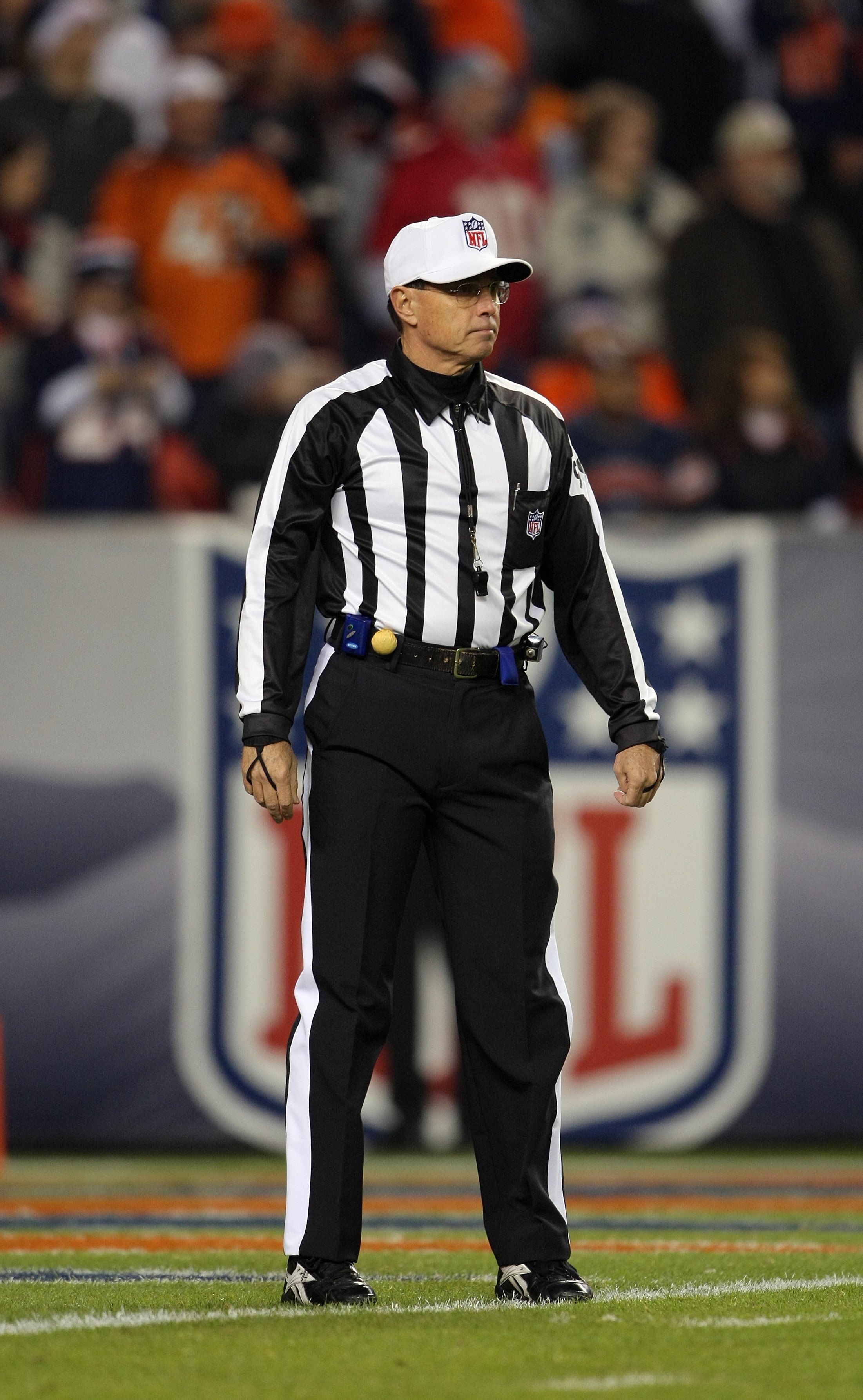 Referee Tony Corrente, left, watches a replay in the first half of