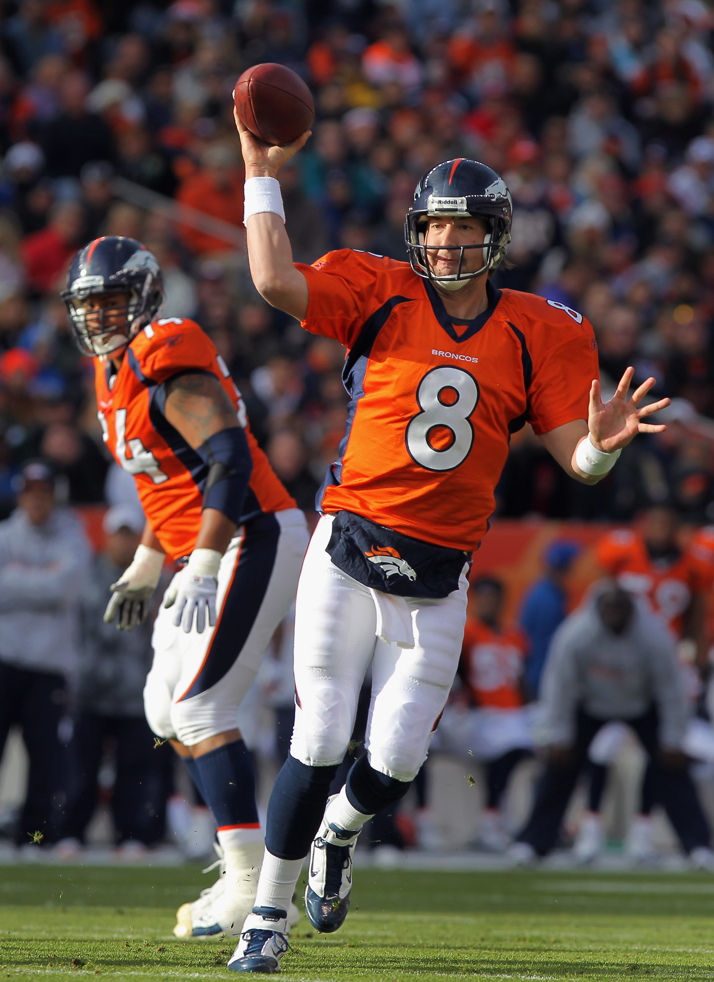 DENVER - NOVEMBER 14:  Quarterback Kyle Orton #8 of the Denver Broncos rolls out and delivers a pass against the Kansas City Chiefs in the first quarter at INVESCO Field at Mile High on November 14, 2010 in Denver, Colorado. The Broncos defeated the Chief