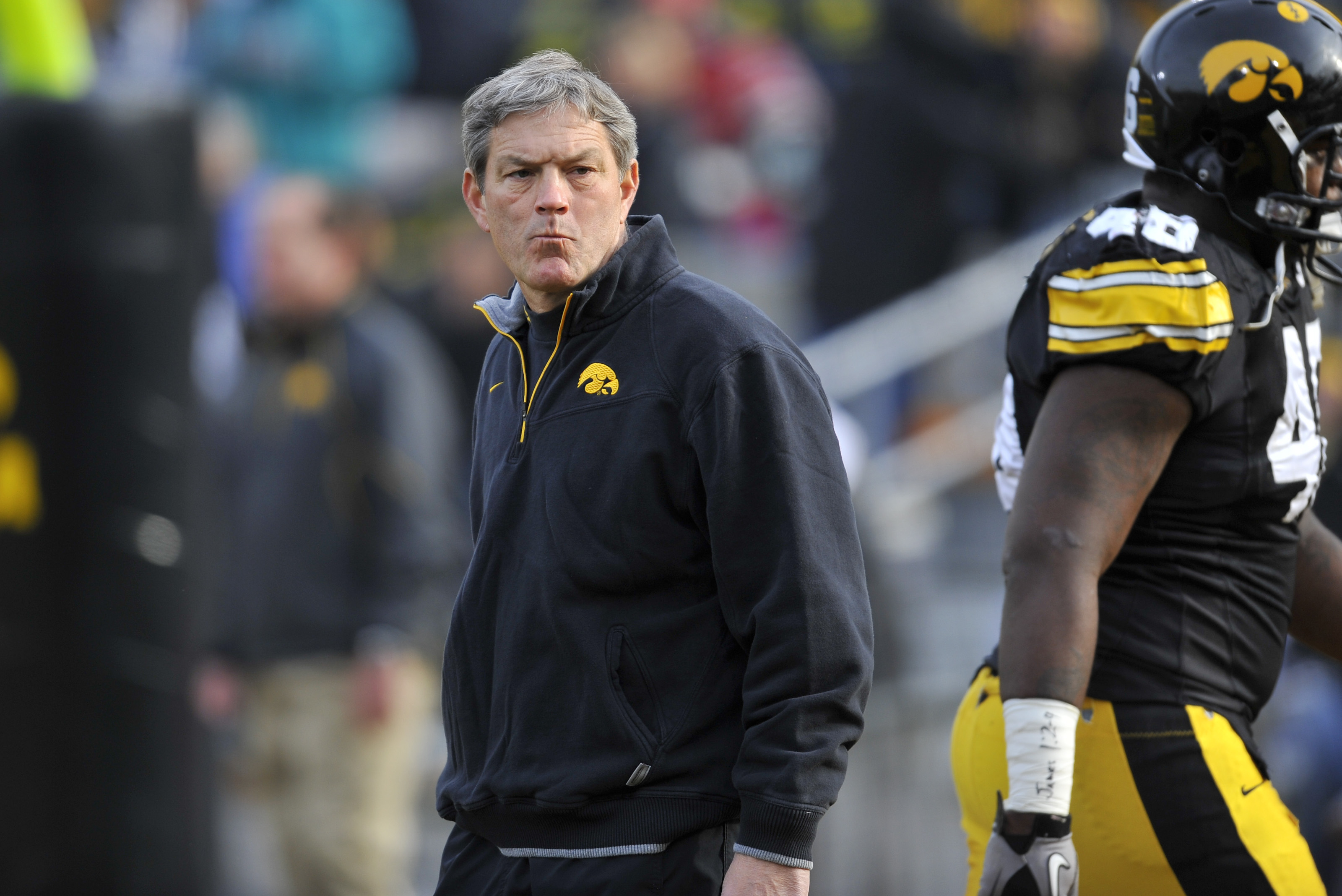 IOWA CITY, IA - NOVEMBER 20: University of Iowa Hawkeyes head coach Kirk Ferentz looks on from the sideline during pre game warm ups before game action against the Ohio State Buckeyes at Kinnick Stadium on November 20, 2010 in Iowa City, Iowa. Ohio State