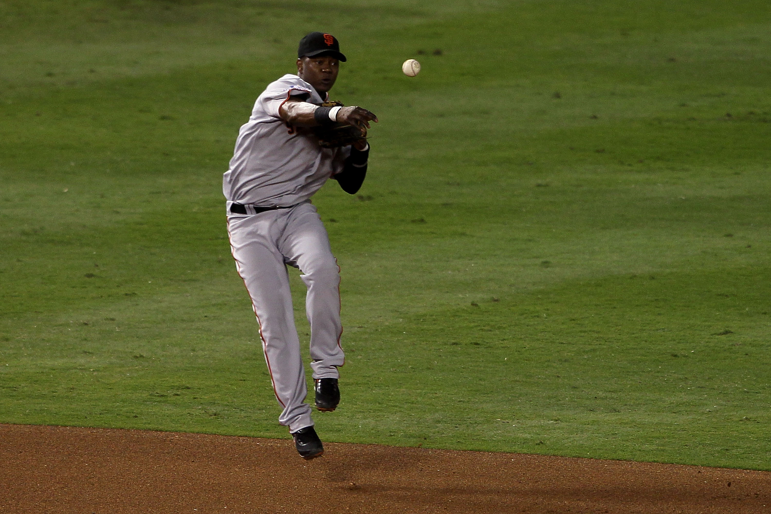 Atlanta Braves' Edgar Renteria, center, and Yunel Escobar, right