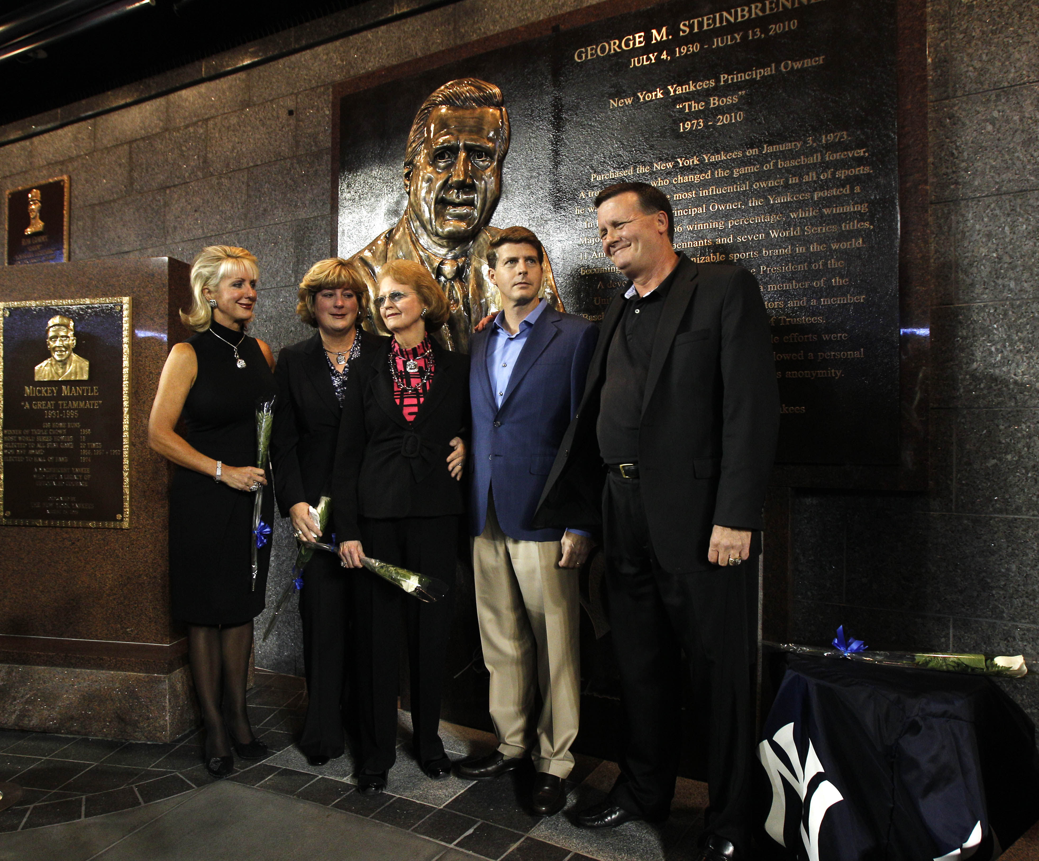 NEW YORK - SEPTEMBER 20:  Members of the Steinbrenner family pose for photographers following a ceremony dedicating a monument to the late Yankees principal owner George Steinbrenner before the Yankees baseball game against the Tampa Bay Rays on September
