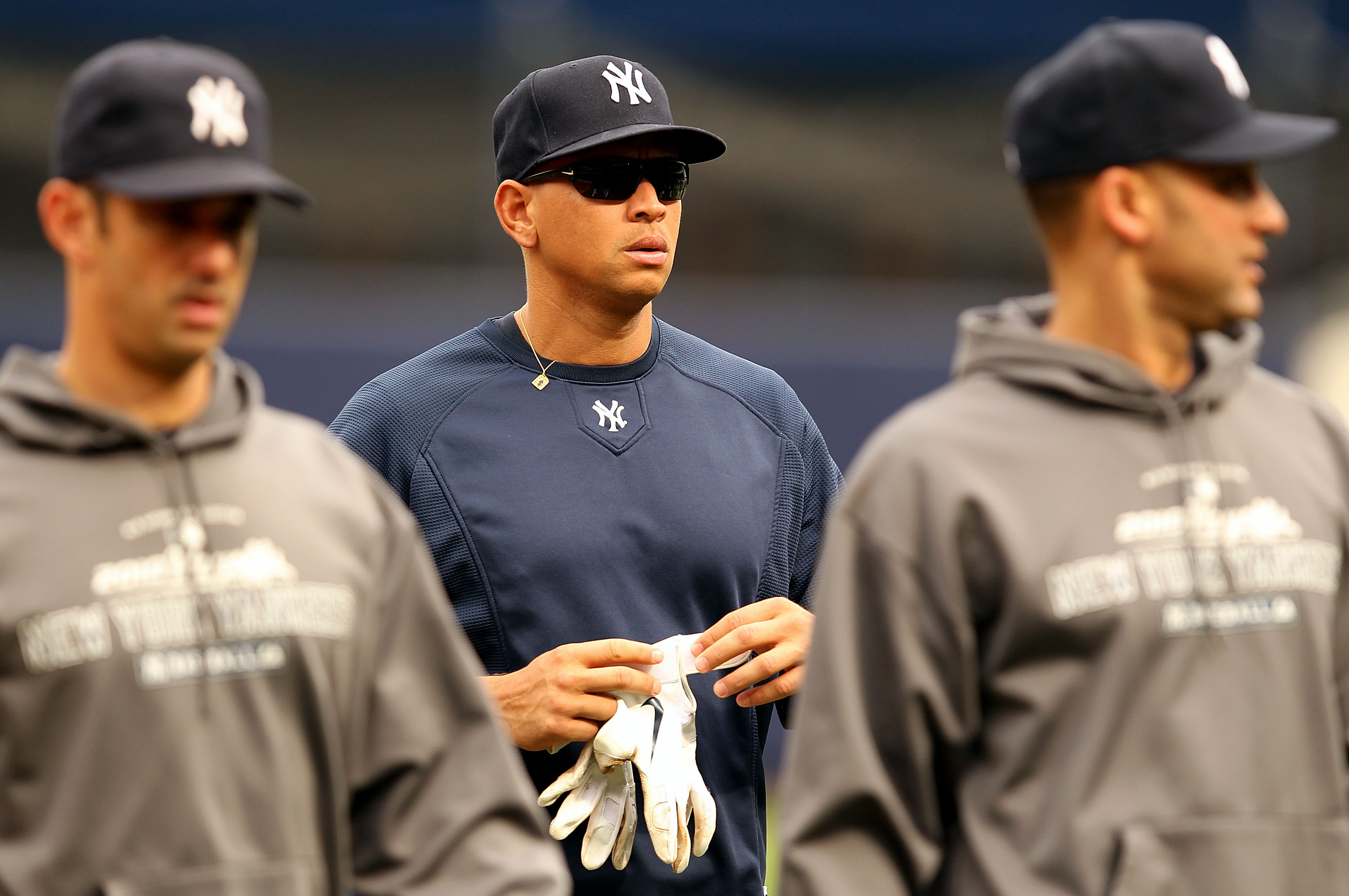 NEW YORK - OCTOBER 20:  Alex Rodriguez #13 of the New York Yankees walks on the field with Jorge Posada #20 (R) and Derek Jeter #2 during batting practice against the Texas Rangers in Game Five of the ALCS during the 2010 MLB Playoffs at Yankee Stadium on