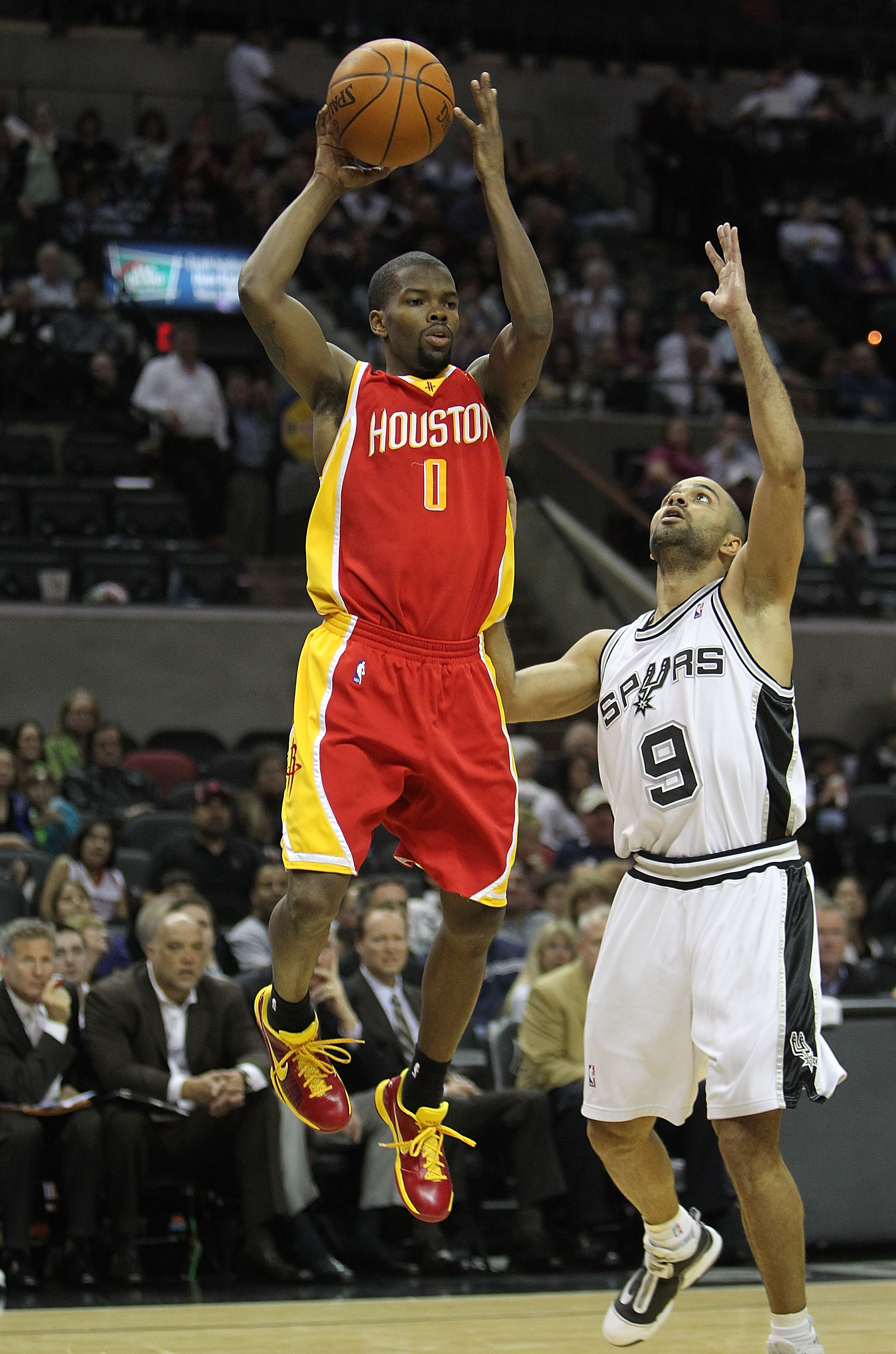 SAN ANTONIO - JANUARY 22:  Guard Aaron Brooks #0 of the Houston Rockets takes a shot against Tony Parker #9 of the San Antonio Spurs at AT&T Center on January 22, 2010 in San Antonio, Texas. NOTE TO USER: User expressly acknowledges and agrees that, by do
