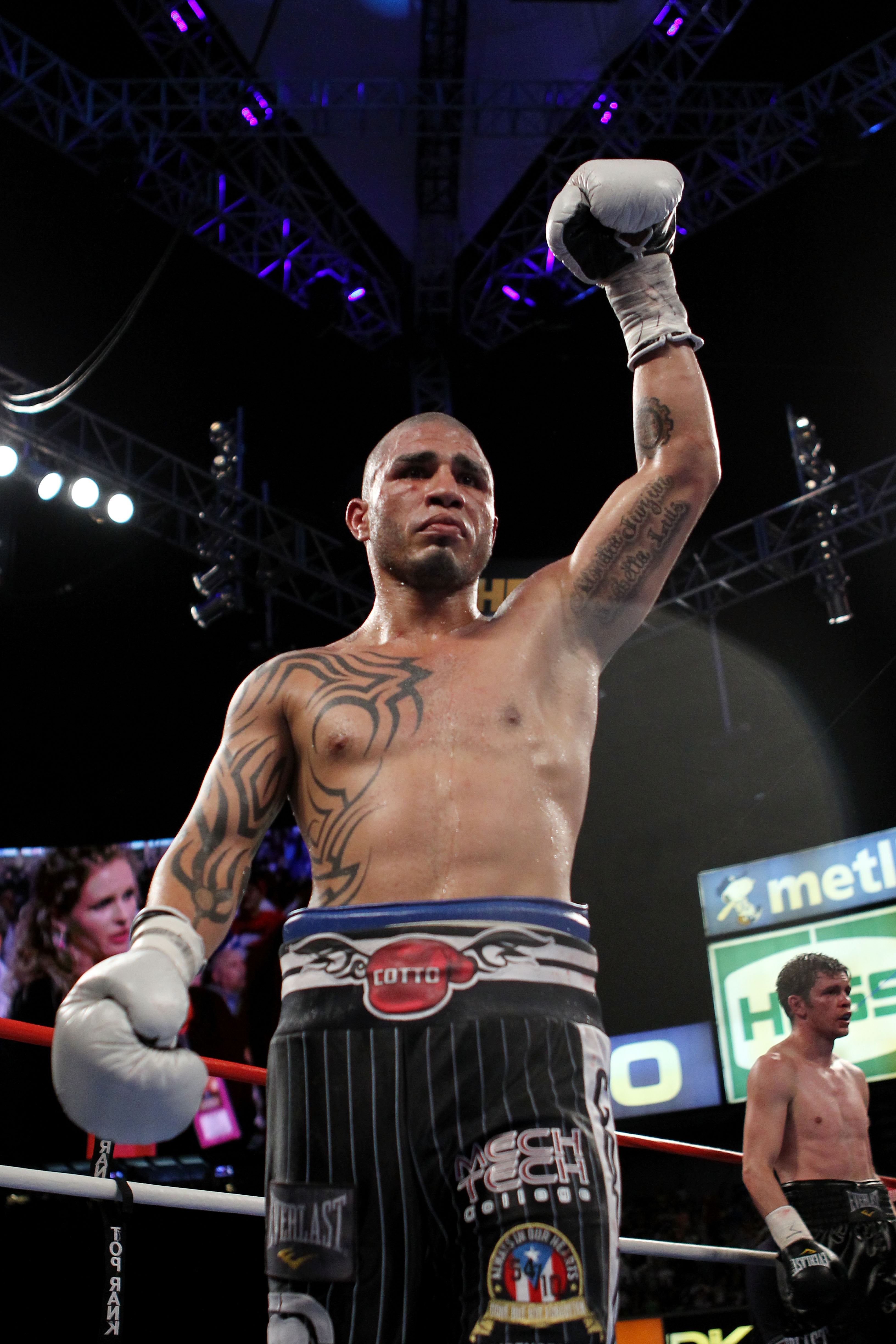 NEW YORK - JUNE 05: (L-R) Miguel Cotto of Puerto Rico prematurely celebrates during his bout with Yuri Foreman after Foreman's corner throws in a towel during the WBA world super welterweight title fight on June 5, 2010 at Yankee Stadium in the Bronx bor
