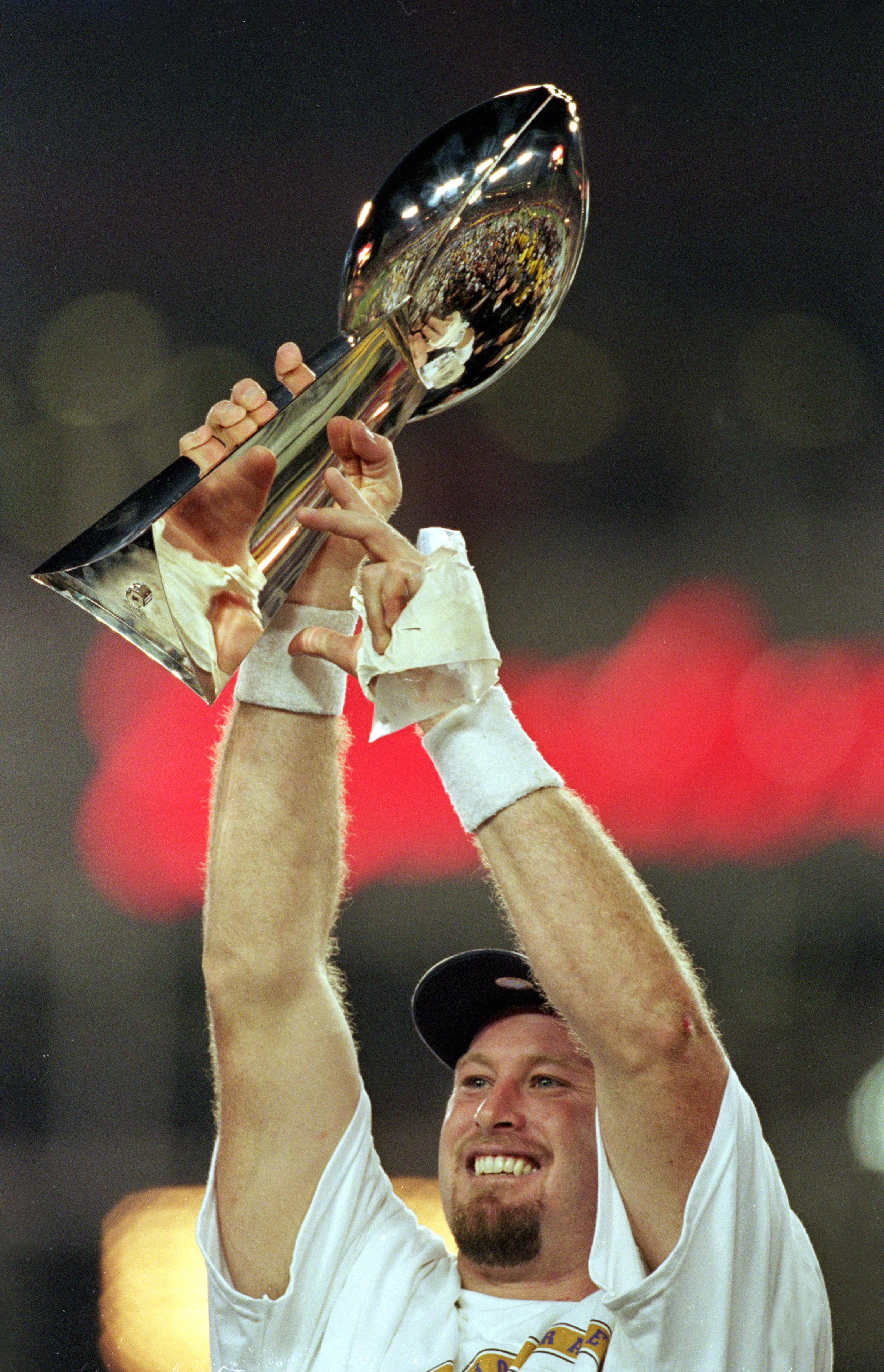 28 Jan 2001:  Trent Dilfer #8 of the Baltimore Ravens holds up the Lombardi Trophy after the Super Bowl XXXV Game against the New York Giants at the Raymond James Stadium in Tampa, Florida. The Ravens defeated the Giants 34-7.Mandatory Credit: Andy Lyons
