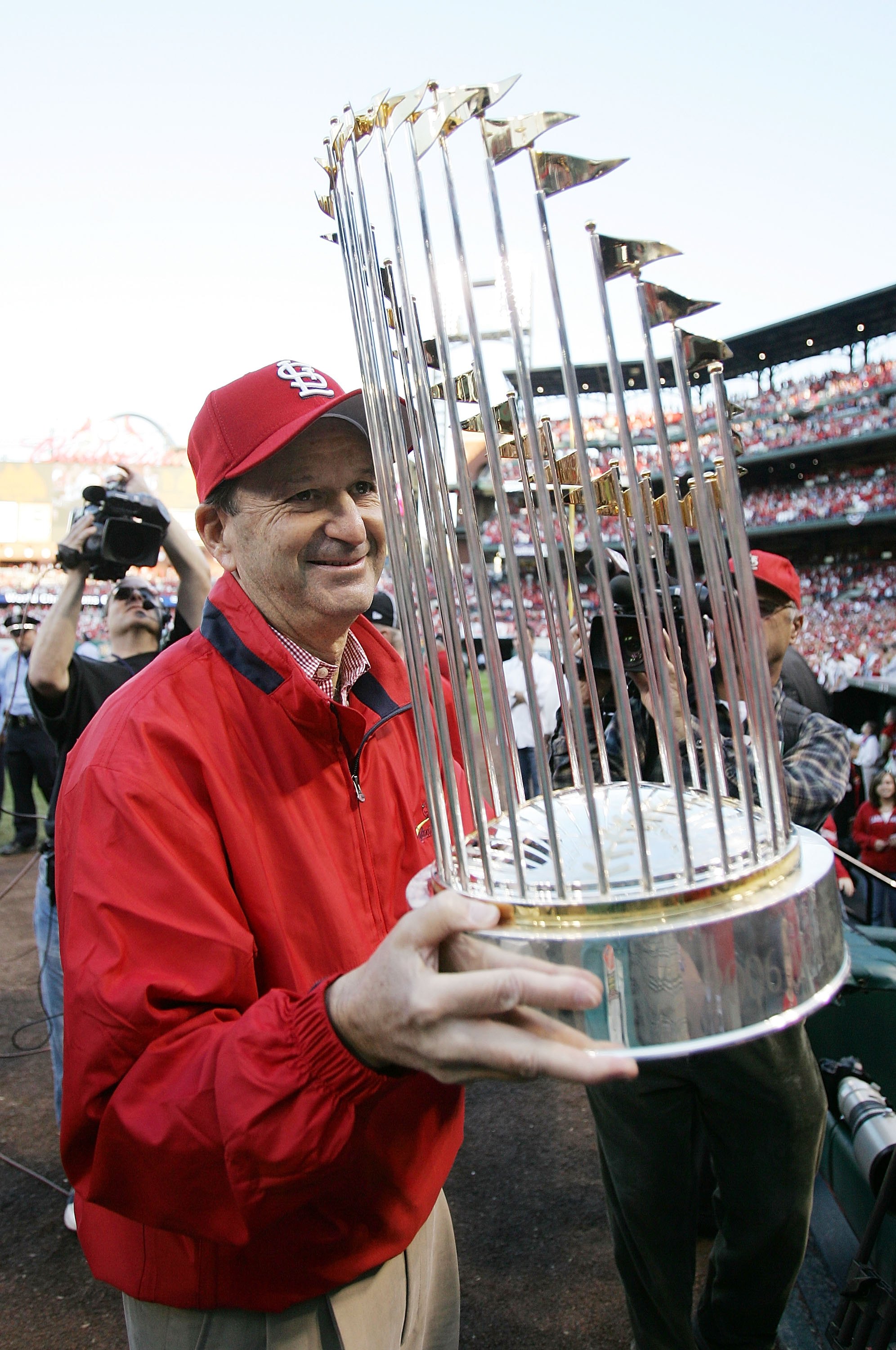 ST LOUIS, MO - OCTOBER 29:  CEO and principle owner Bill DeWitt Jr. holds the trophy after the St. Louis Cardinals World Series Victory Parade and Rally at Busch Stadium on October 29, 2006 in St. Louis, Missouri.  (Photo by Elsa/Getty Images)