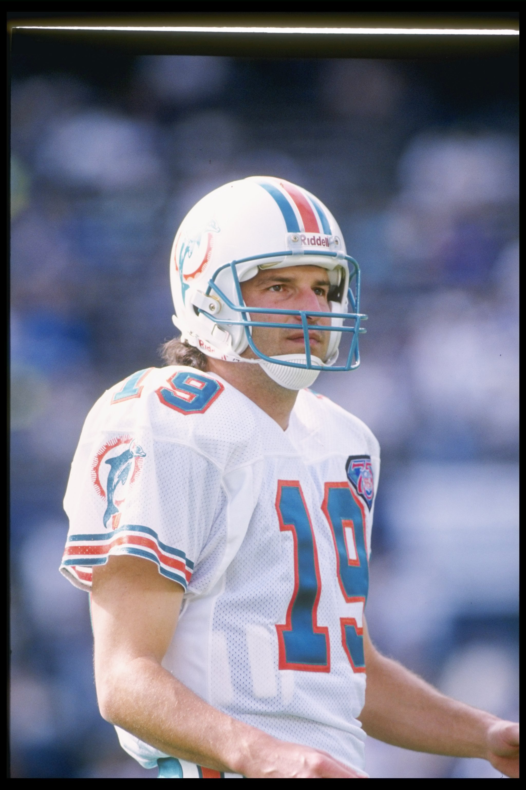 8 Jan 1995:  Quarterback Bernie Kosar of the Miami Dolphins stands on the field during a playoff game against the San Diego Chargers at Jack Murphy Stadium in San Diego, California.  The Chargers won the game 22-21. Mandatory Credit: Otto Greule Jr.  /All