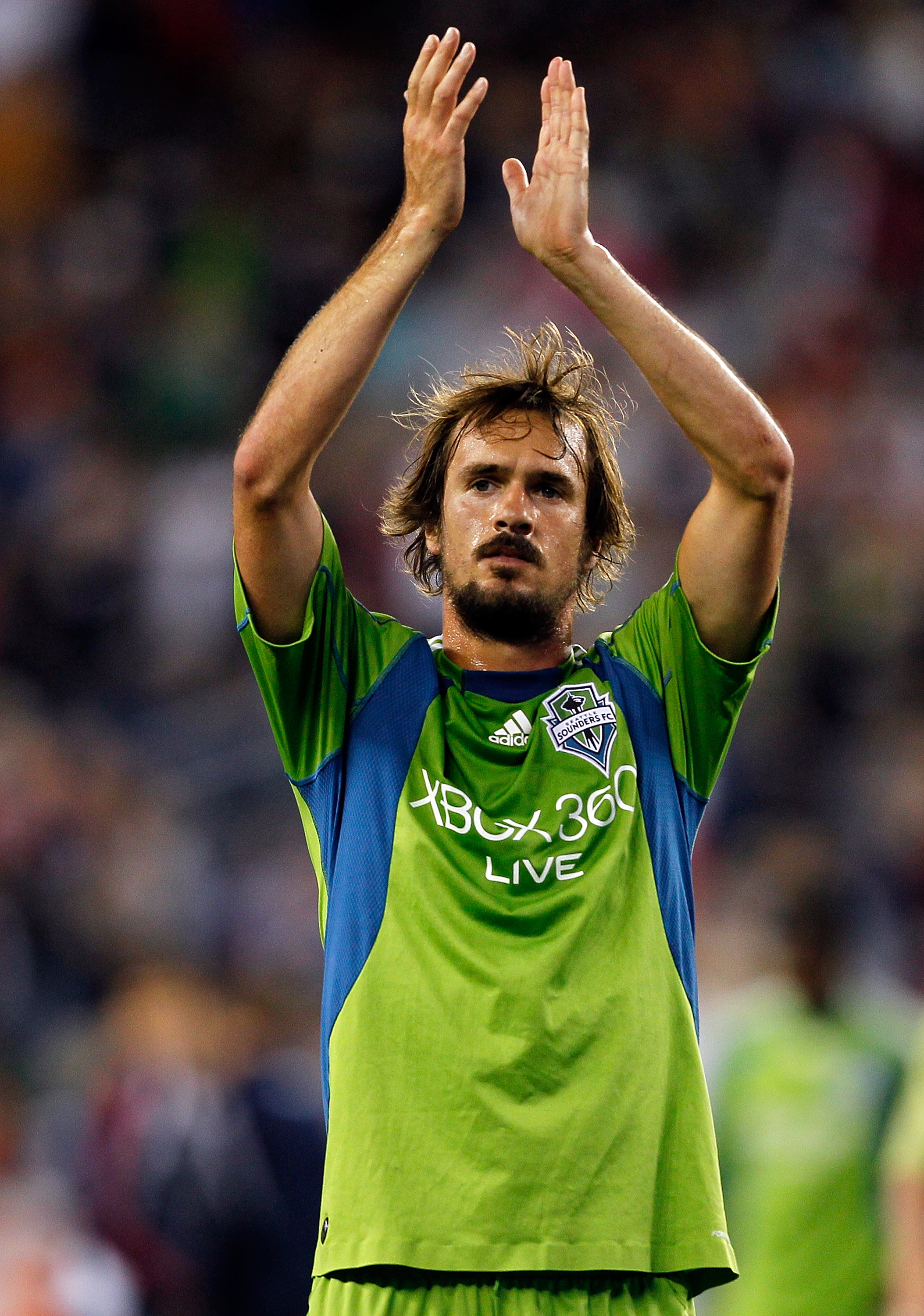 FOXBORO, MA - SEPTEMBER 4:  Roger Levesque #24 of the Seattle Sounders FC acknowledges the crowd at the end of a game against the New England Revolution at Gillette Stadium on September 4, 2010 in Foxboro, Massachusetts. (Photo by Gail Oskin/Getty Images)