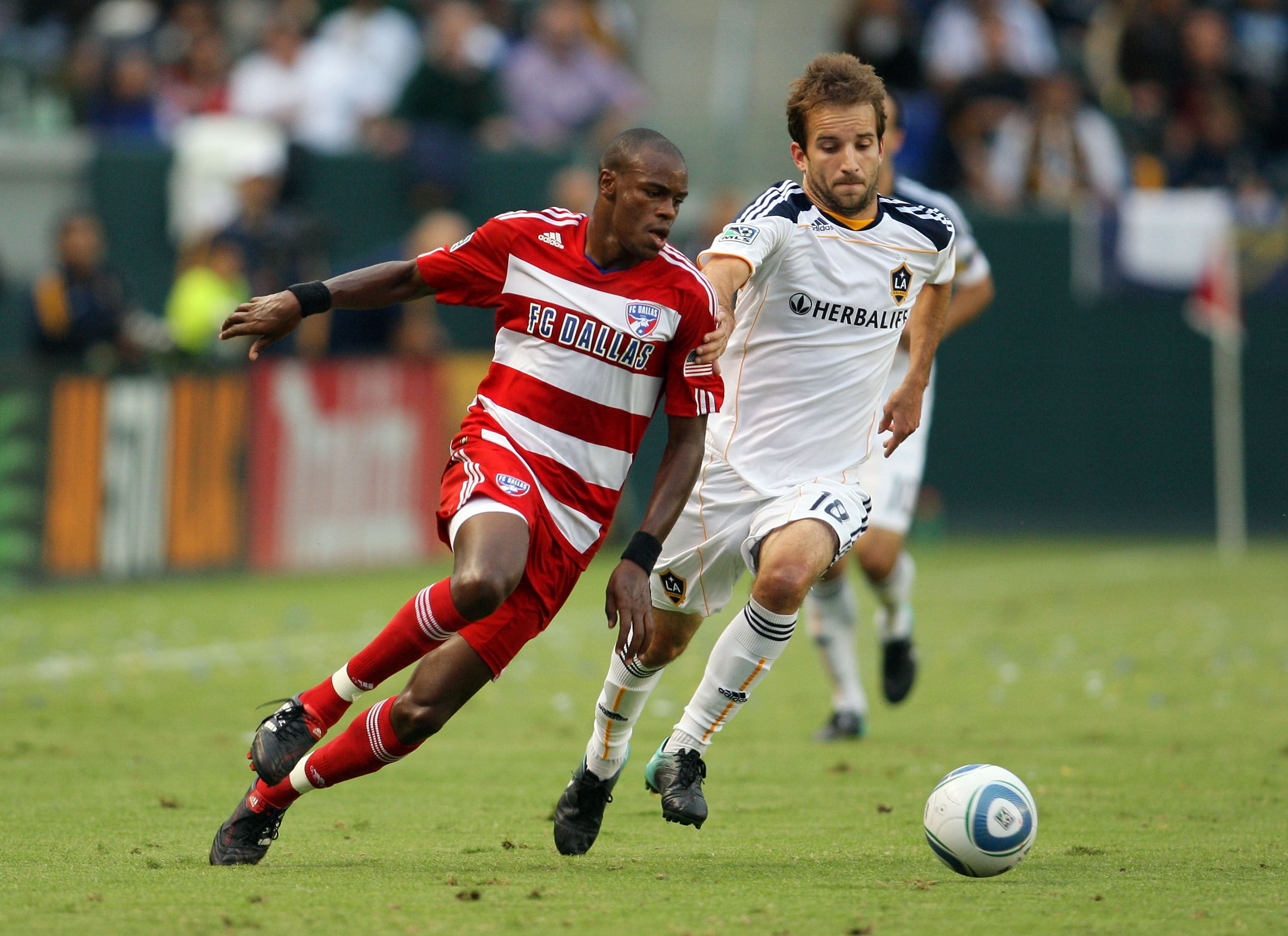 CARSON, CA - OCTOBER 24:  Jackson Goncalves #6 of FC Dallas and Mike Magee #18 of the Los Angeles Galaxy vie for position to the ball in the first half during the MLS match on October 24, 2010 in Carson, California.  (Photo by Victor Decolongon/Getty Imag