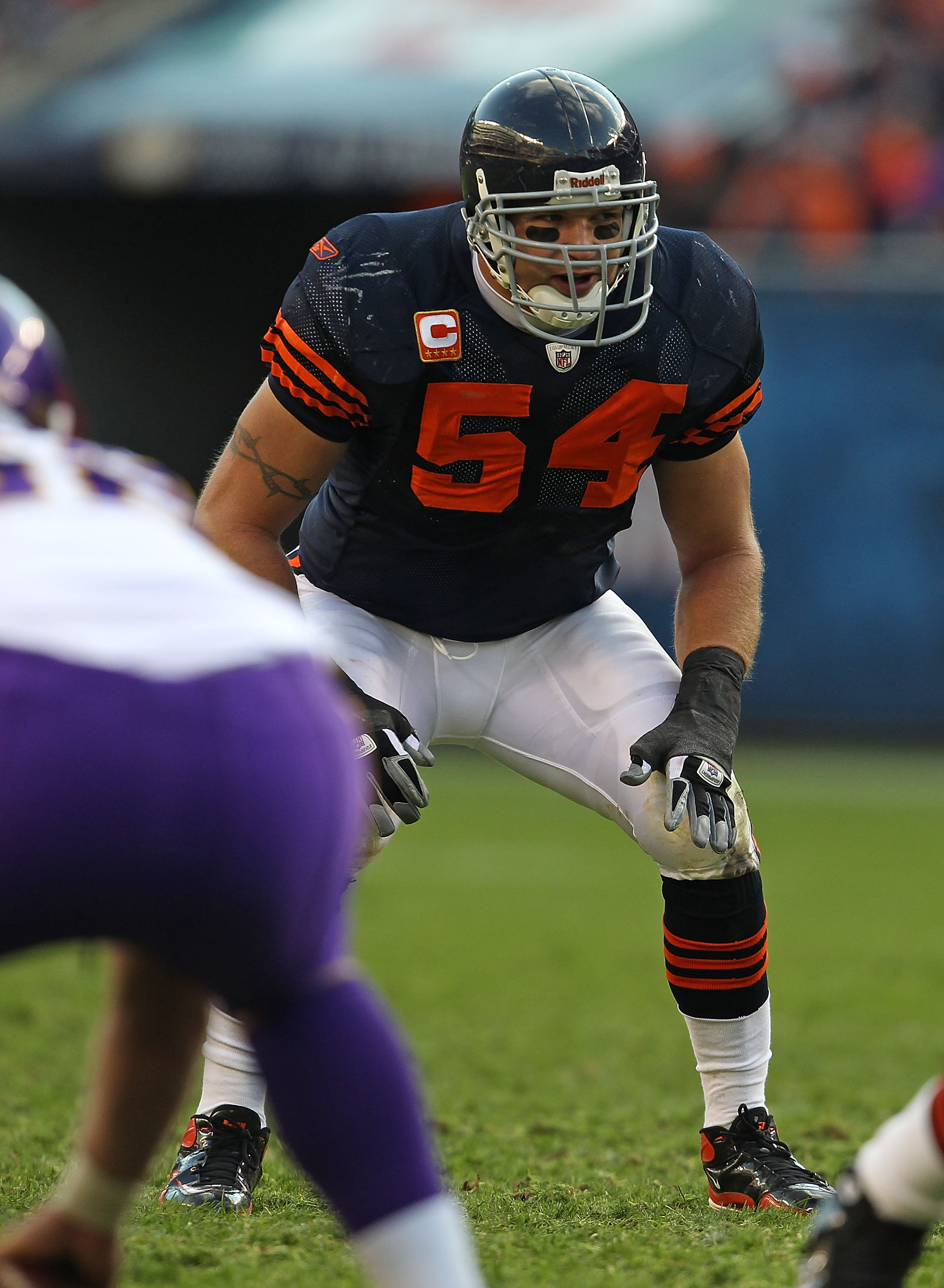 Brian Urlacher of the Chicago Bears warms up prior turnover