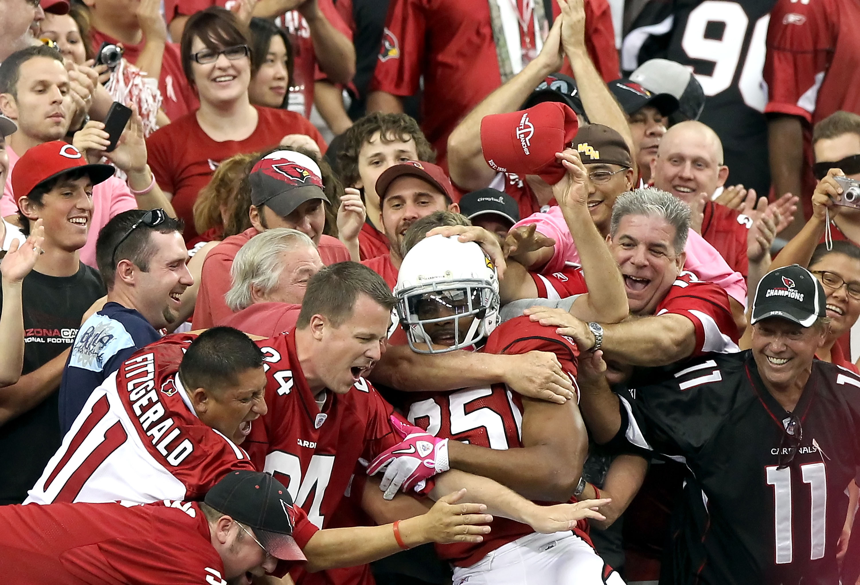 An Arizona Cardinals fan dressed as Santa Claus signals for a safety in the  fourth quarter of the Cardinals-Green Bay Packers game at University of  Phoenix Stadium in Glendale, Arizona, December 27