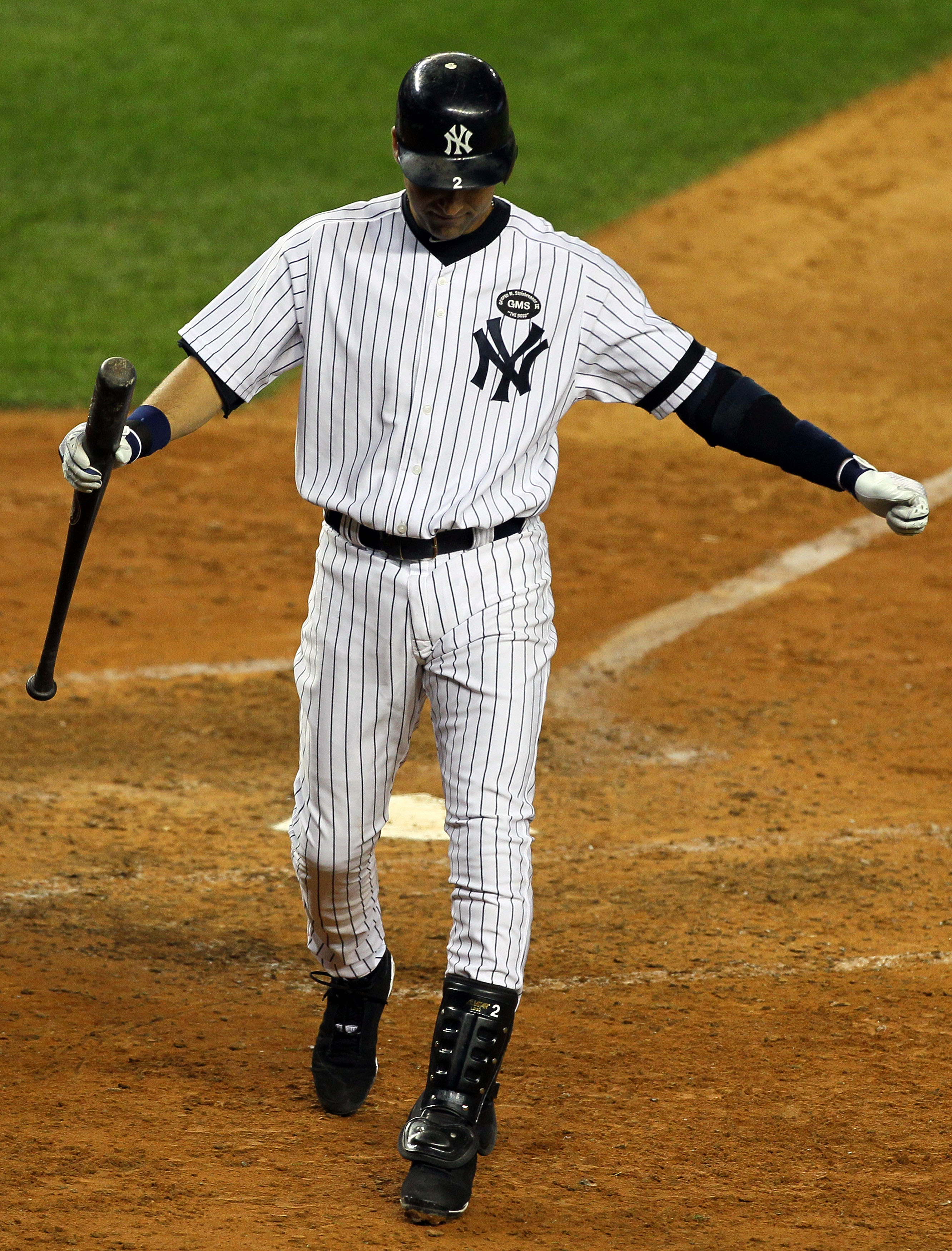 NEW YORK - OCTOBER 18:  Derek Jeter #2 of the New York Yankees reacts after he struck out in the top of the ninth inning against the Texas Rangers in Game Three of the ALCS during the 2010 MLB Playoffs at Yankee Stadium on October 18, 2010 in New York, Ne