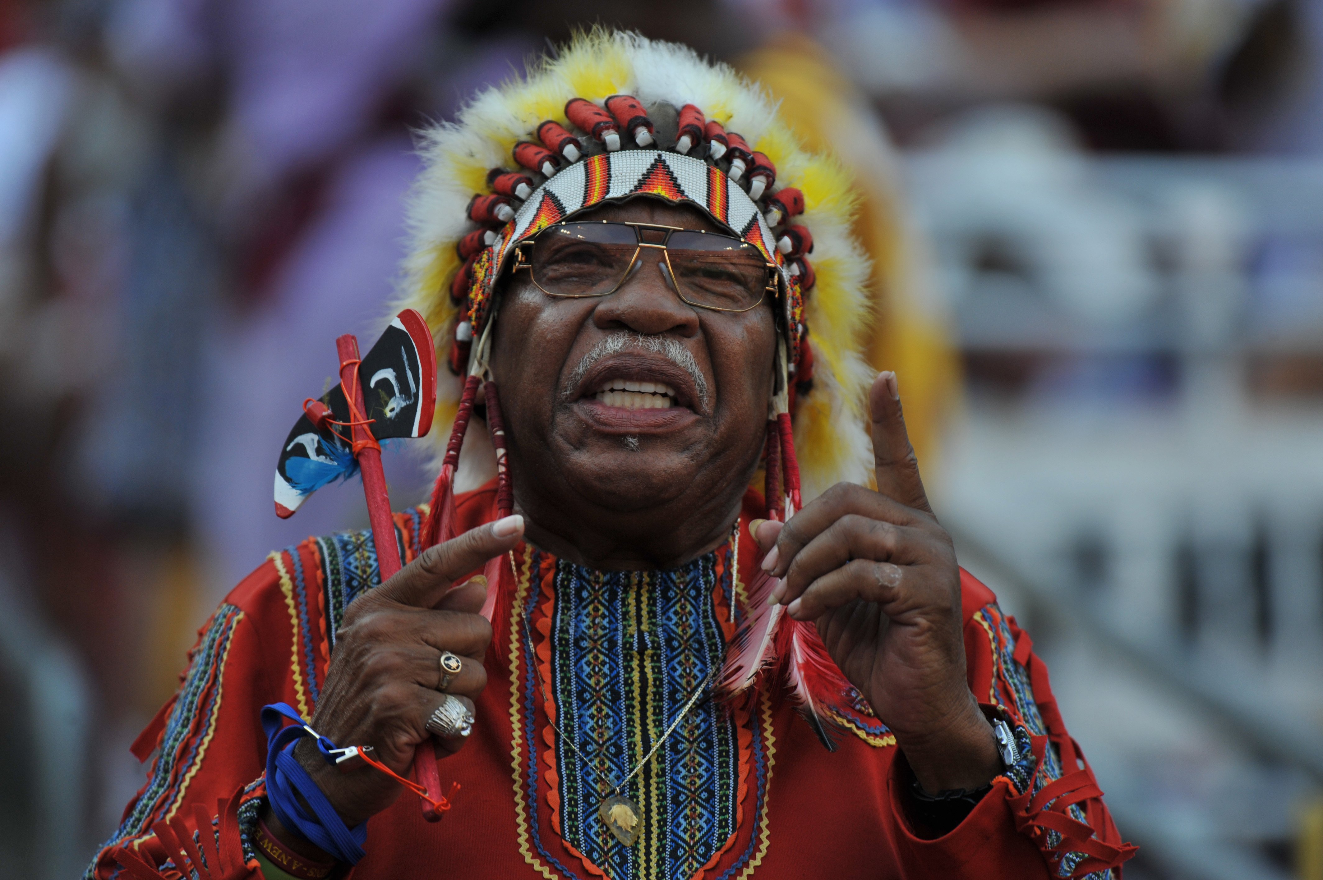 LANDOVER - SEPTEMBER 19:  A fan of the Washington Redskins cheers against the Houston Texans at FedExField on September 19, 2010 in Landover, Maryland. The Texans defeated the Redskins in overtime 30-27. (Photo by Larry French/Getty Images)