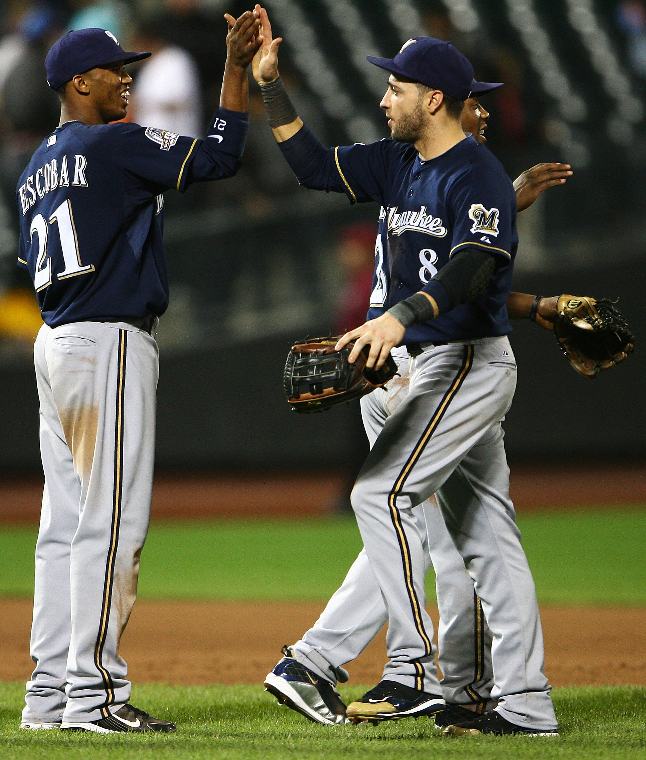 NEW YORK - SEPTEMBER 30:  Alcides Esobar #21 and Ryan Bauer #8 of the Milwaukee Brewers celebrate after beating the New York Mets 9 - 2 on September 30, 2010 at Citi Field in the Flushing neighborhood of the Queens borough of New York City. This was the f