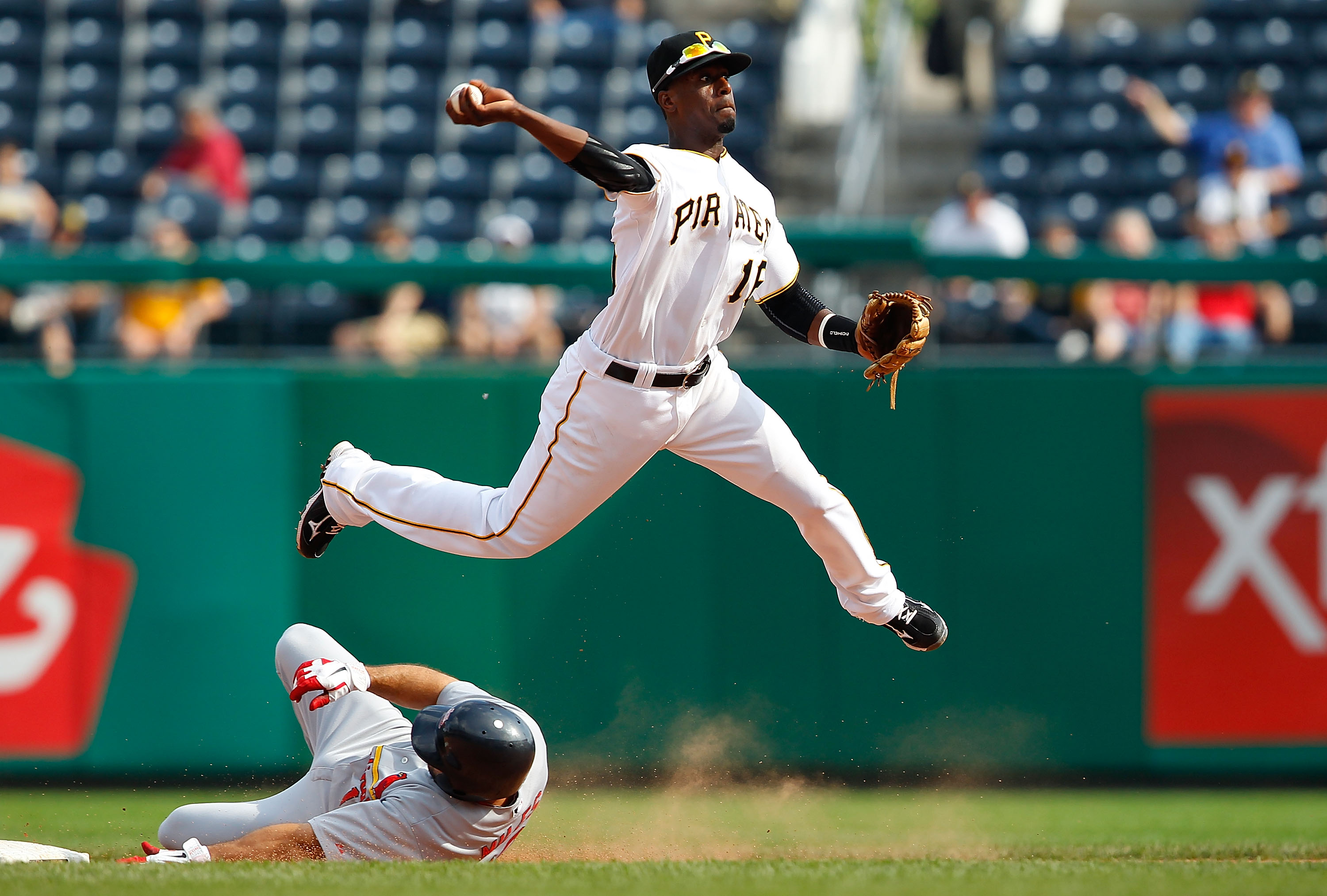 PITTSBURGH - SEPTEMBER 23:  Pedro Ciriaco #16 of the Pittsburgh Pirates turns a double play against the St Louis Cardinals during the game on September 23, 2010 at PNC Park in Pittsburgh, Pennsylvania.  (Photo by Jared Wickerham/Getty Images)