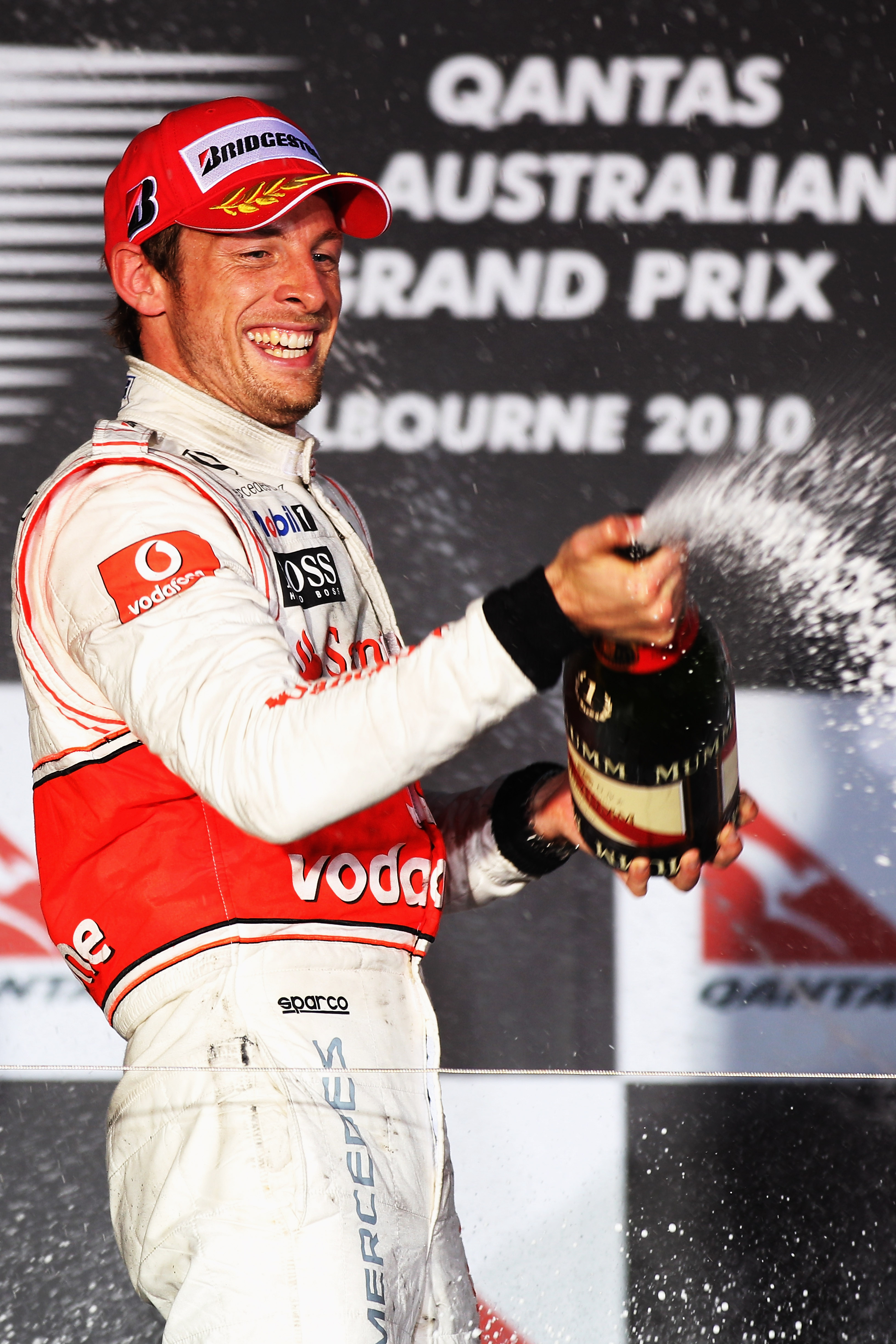 MELBOURNE, AUSTRALIA - MARCH 28:  Jenson Button of Great Britain and McLaren Mercedes celebrates winning the the Australian Formula One Grand Prix at the Albert Park Circuit on March 28, 2010 in Melbourne, Australia.  (Photo by Mark Thompson/Getty Images)