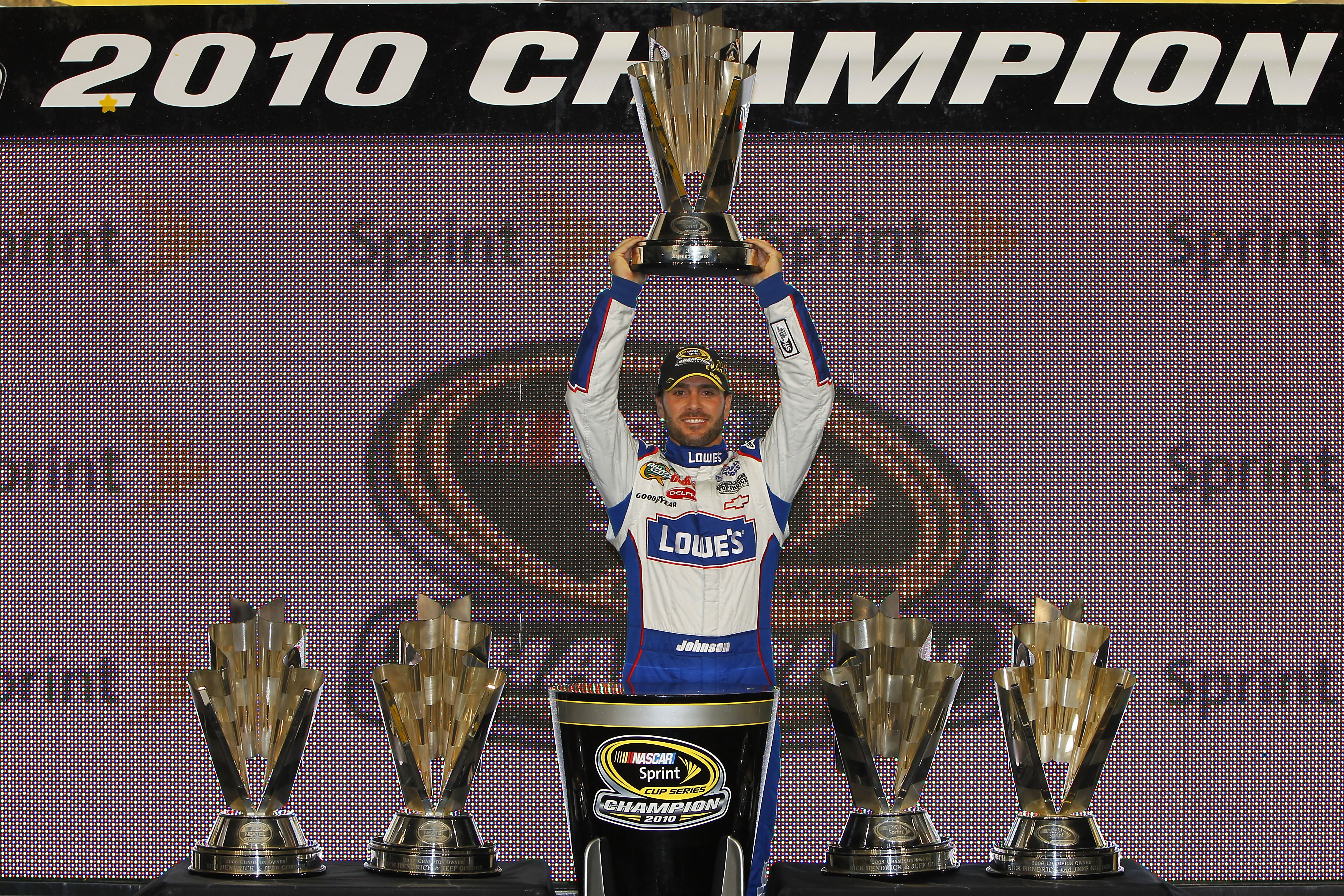 HOMESTEAD, FL - NOVEMBER 21:  Jimmie Johnson, driver of the #48 Lowe's Chevrolet, celebrates after finishing in second place in the Ford 400 to clinch his fifth consecutive NASCAR Sprint Cup championship at Homestead-Miami Speedway on November 21, 2010 in