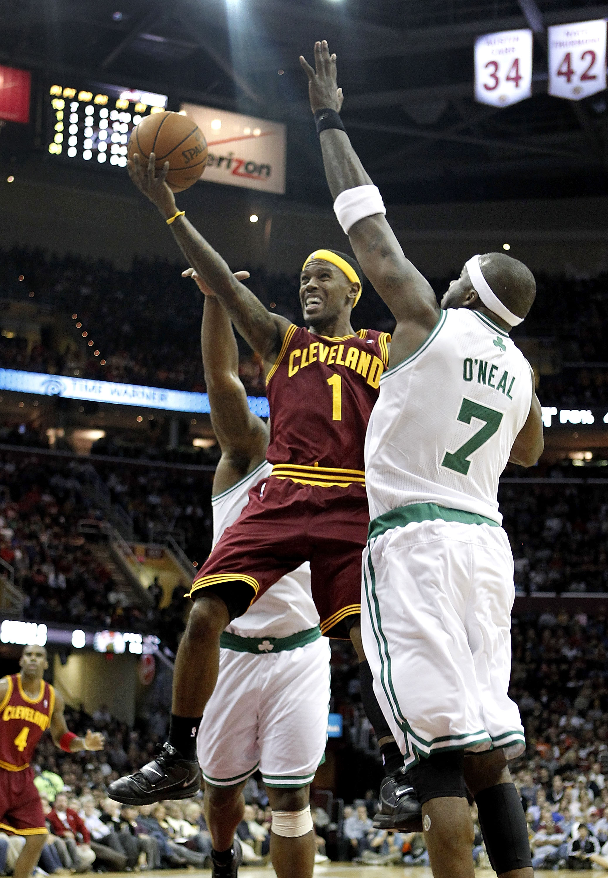 CLEVELAND - OCTOBER 27: Daniel Gibson #1 of the Cleveland Cavaliers tries to get a shot off around Jermaine O'Neal #7 of the Boston Celtics at Quicken Loans Arena on October 27, 2010 in Cleveland, Ohio. Cleveland won the game 95-87.  (Photo by Gregory Sha