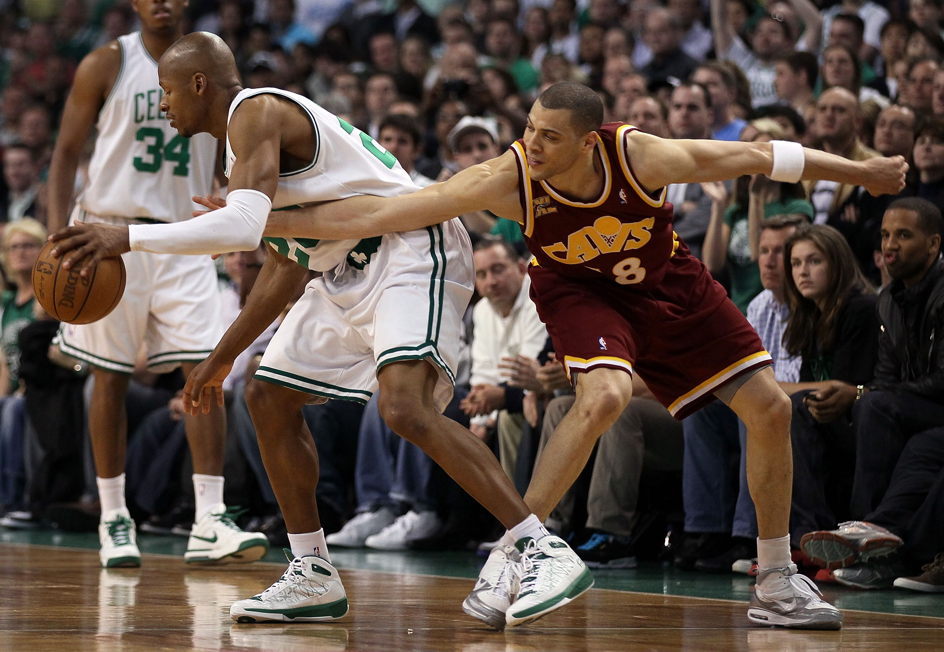 BOSTON - MAY 09:   Ray Allen #20 of the Boston Celtics is fouled by Anthony Parker #18 of the Cleveland Cavaliers during Game Four of the Eastern Conference Semifinals of the 2010 NBA playoffs at TD Garden on May 9, 2010 in Boston, Massachusetts. The Celt