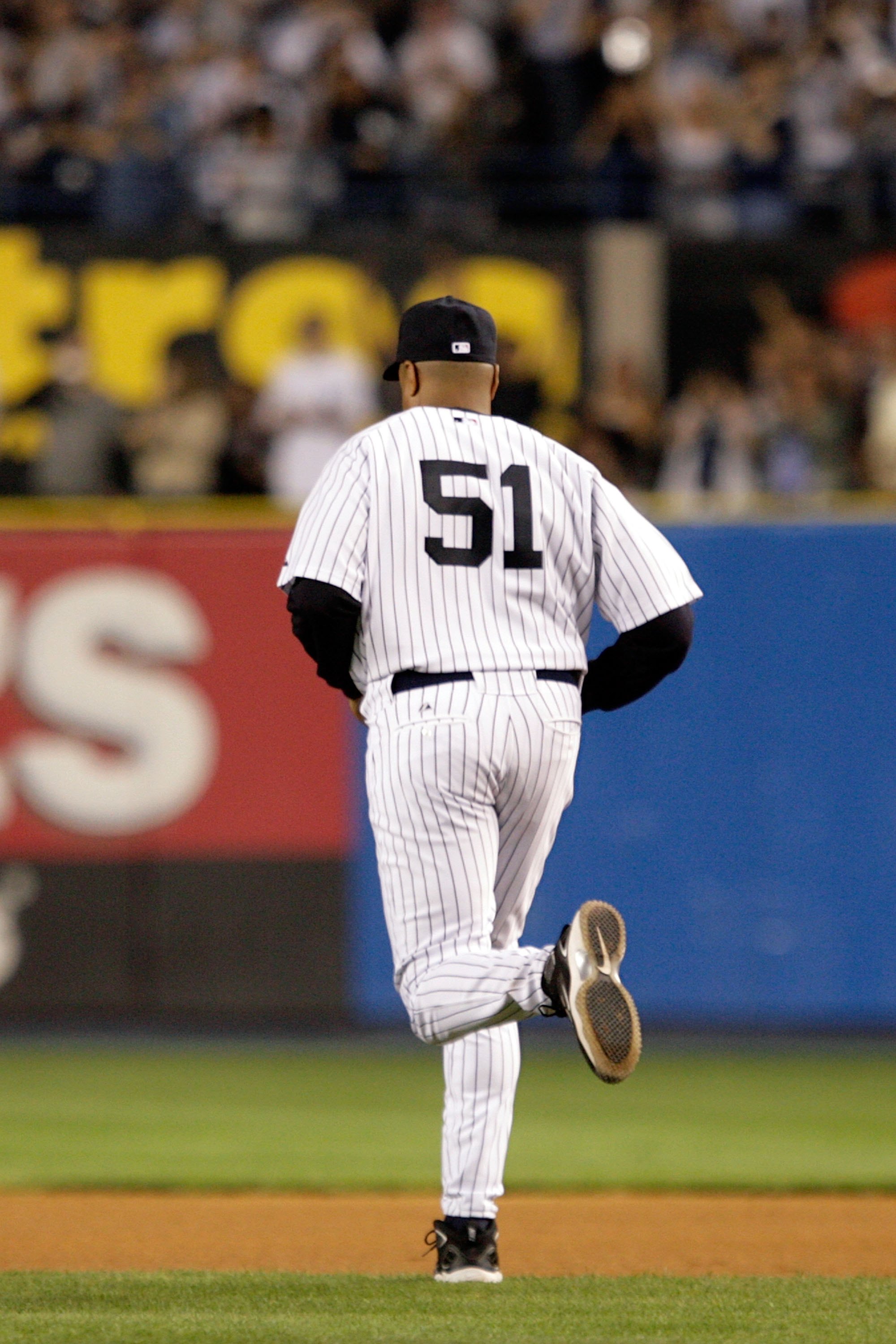 NEW YORK - SEPTEMBER 21:  Former New York Yankee Bernie Williams runs onto the field during a pregame ceremony prior to the start of the last regular season game at Yankee Stadium between the Baltimore Orioles and the New York Yankees on September 21, 200