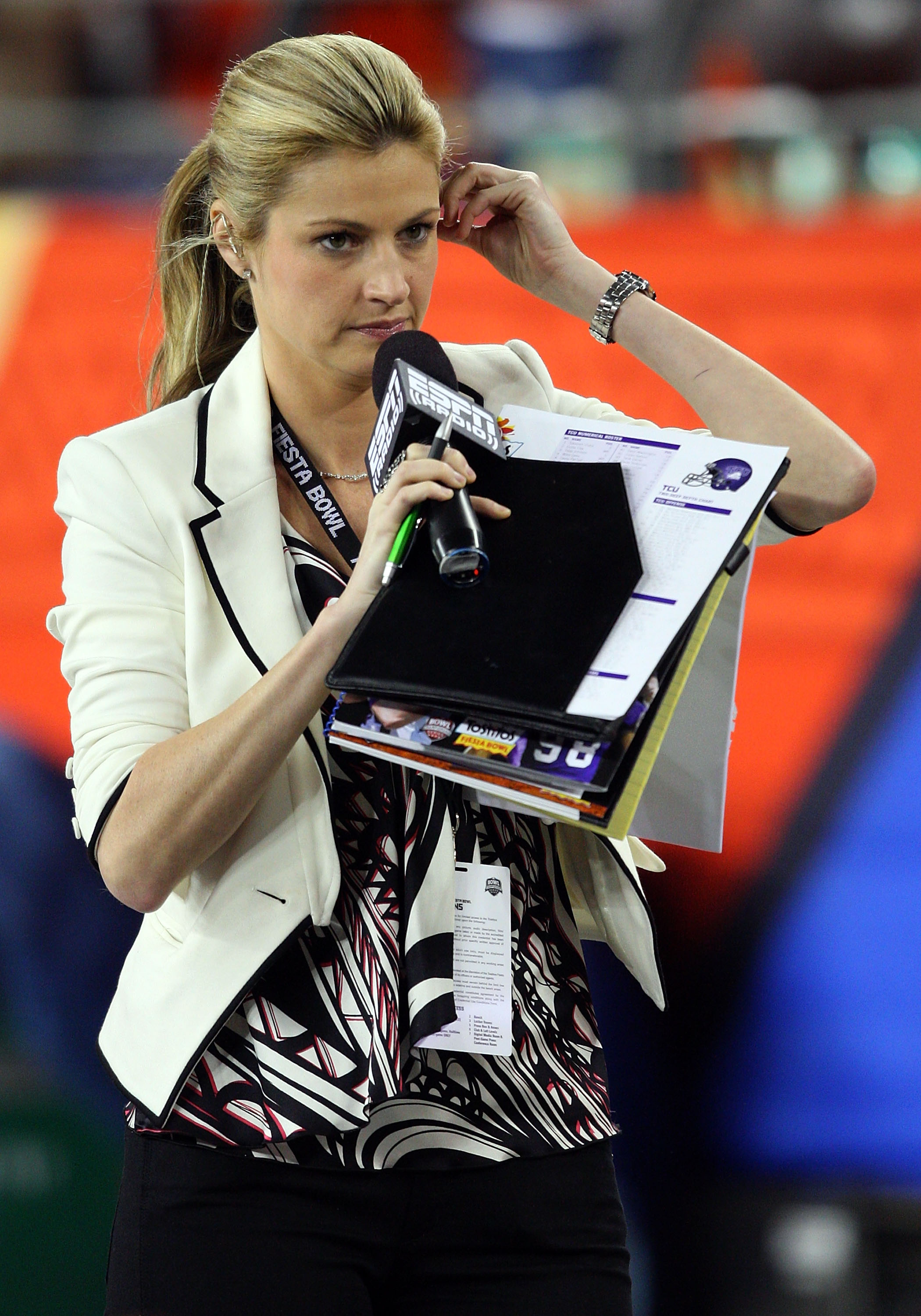 GLENDALE, AZ - JANUARY 04:  ESPN sideline reporter Erin Andrews walks down the sideline at the Tostitos Fiesta Bowl between the Boise State Broncos and the TCU Horned Frogs at the Universtity of Phoenix Stadium on January 4, 2010 in Glendale, Arizona.  (P