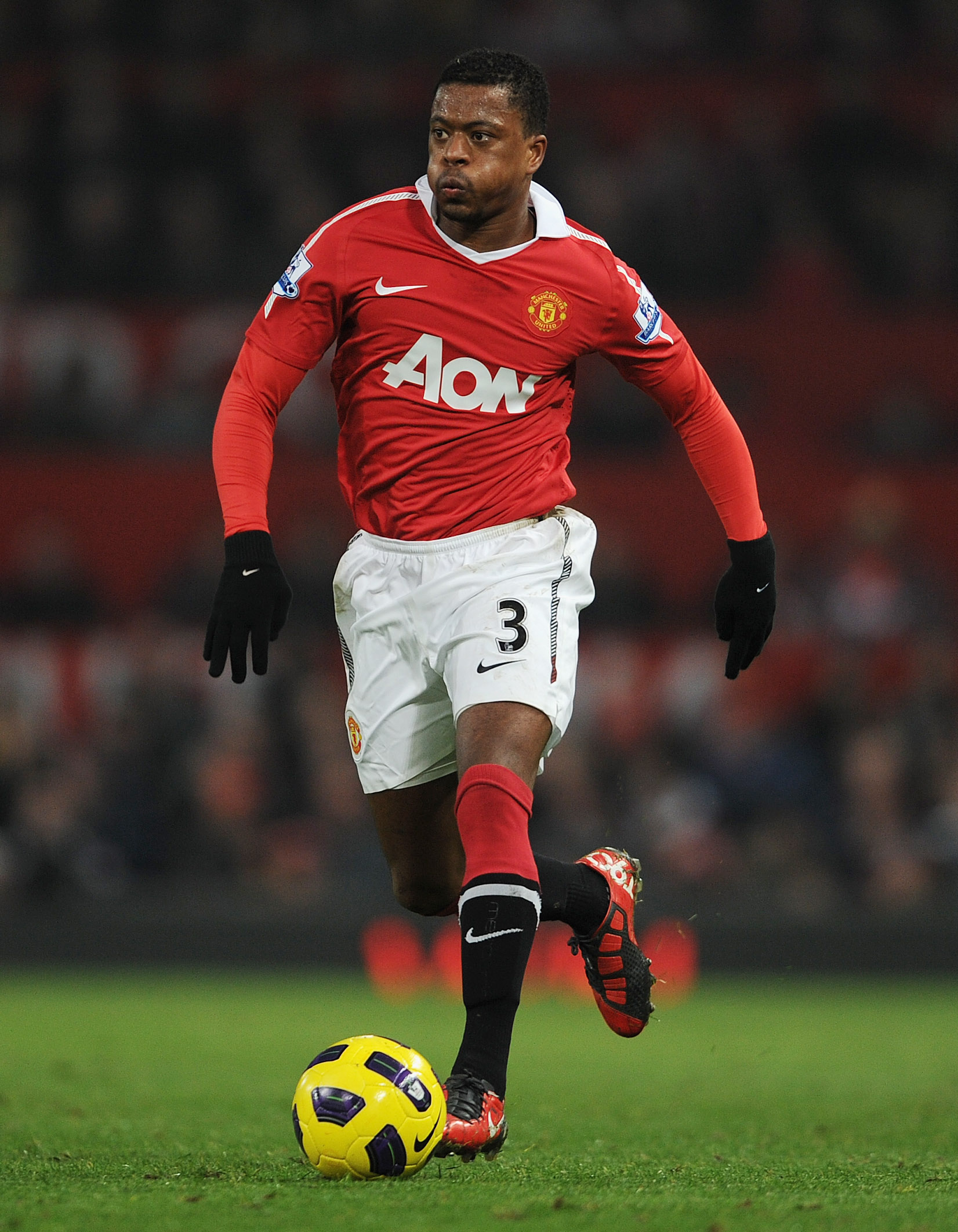 MANCHESTER, ENGLAND - NOVEMBER 20:  Patrice Evra of Manchester United plays the ball during the Barclays Premier League match between Manchester United and Wigan Athletic at Old Trafford on November 20, 2010 in Manchester, England.  (Photo by Michael Rega