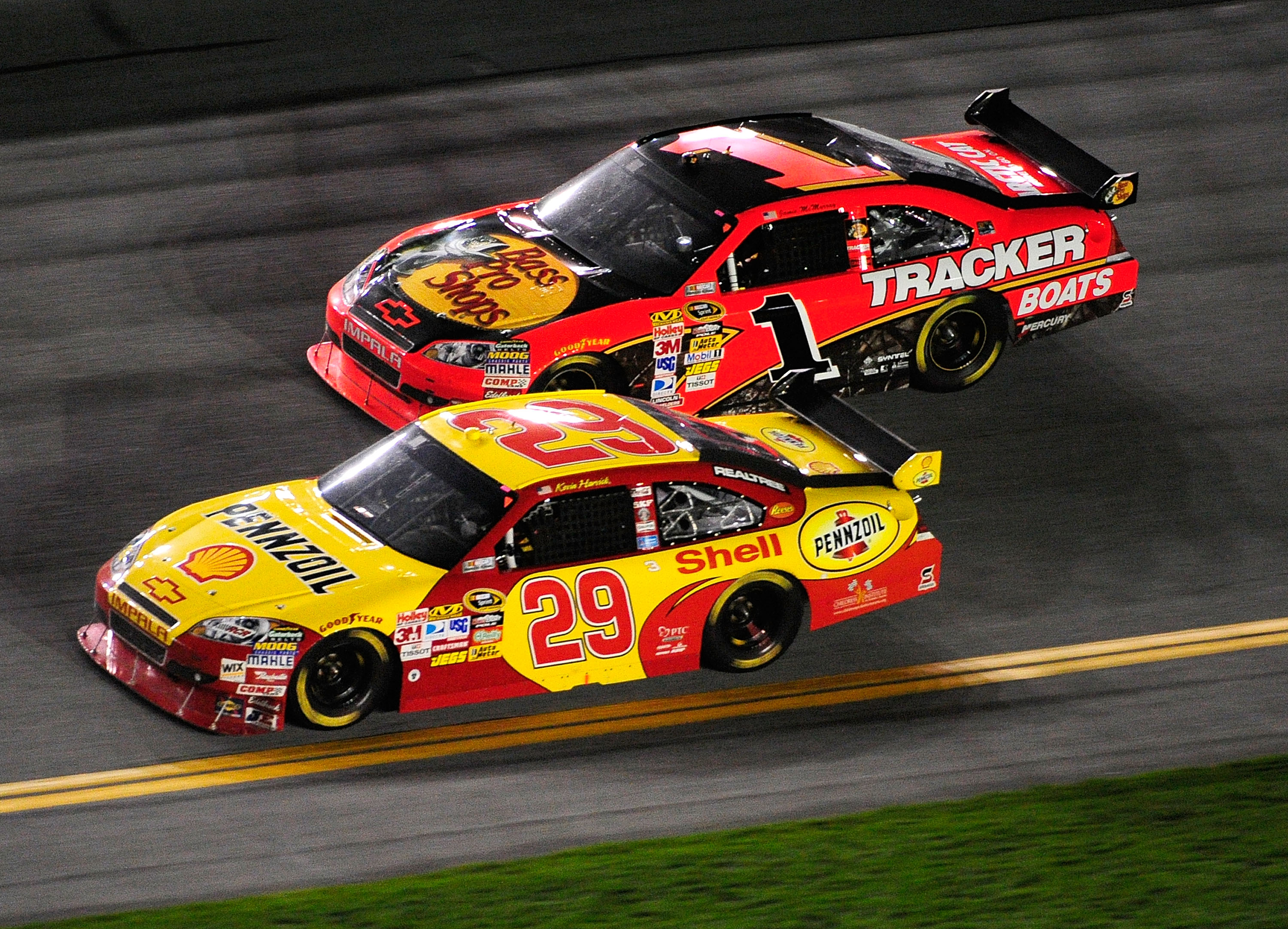 DAYTONA BEACH, FL - FEBRUARY 06:  Kevin Harvick, driver of the #29 Shell/Pennzoil Chevrolet, races Jamie McMurray, driver of the #Bass Pro Shops/Tracker Chevrolet, during the Budweiser Shootout at Daytona International Speedway on February 6, 2010 in Dayt