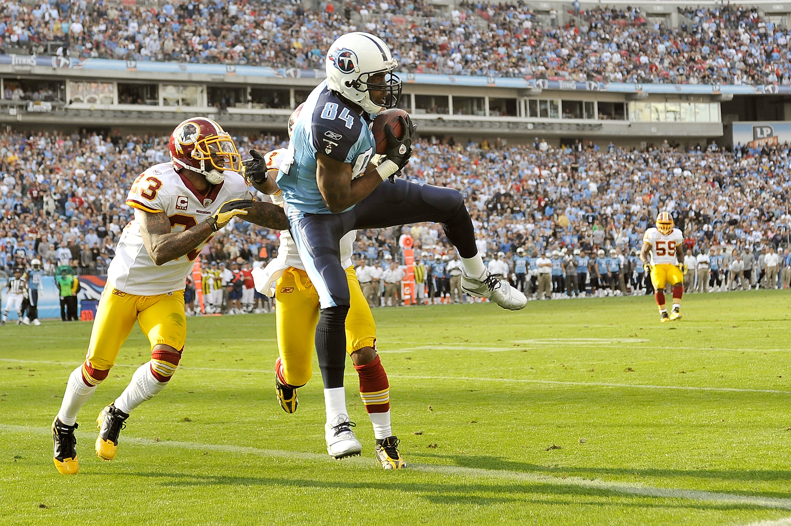 Tennessee Titans wide receiver Randy Moss (84) watches from the sideline in  overtime during an NFL football game against the Washington Redskins on  Sunday, Nov. 21, 2010, in Nashville, Tenn. The Redskins