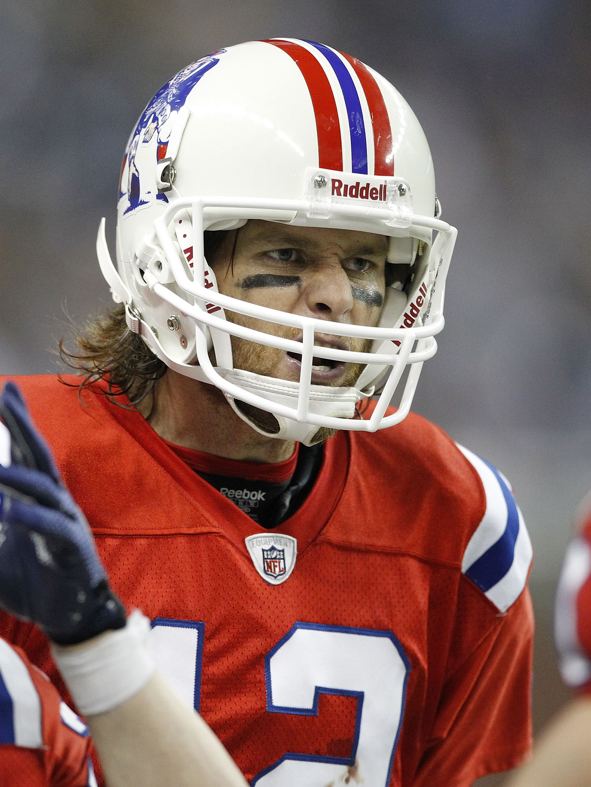 New England Patriots Tom Brady walks off of the field carrying his helmet  and the game ball after the game against the New York Jets defense in week  6 of the NFL