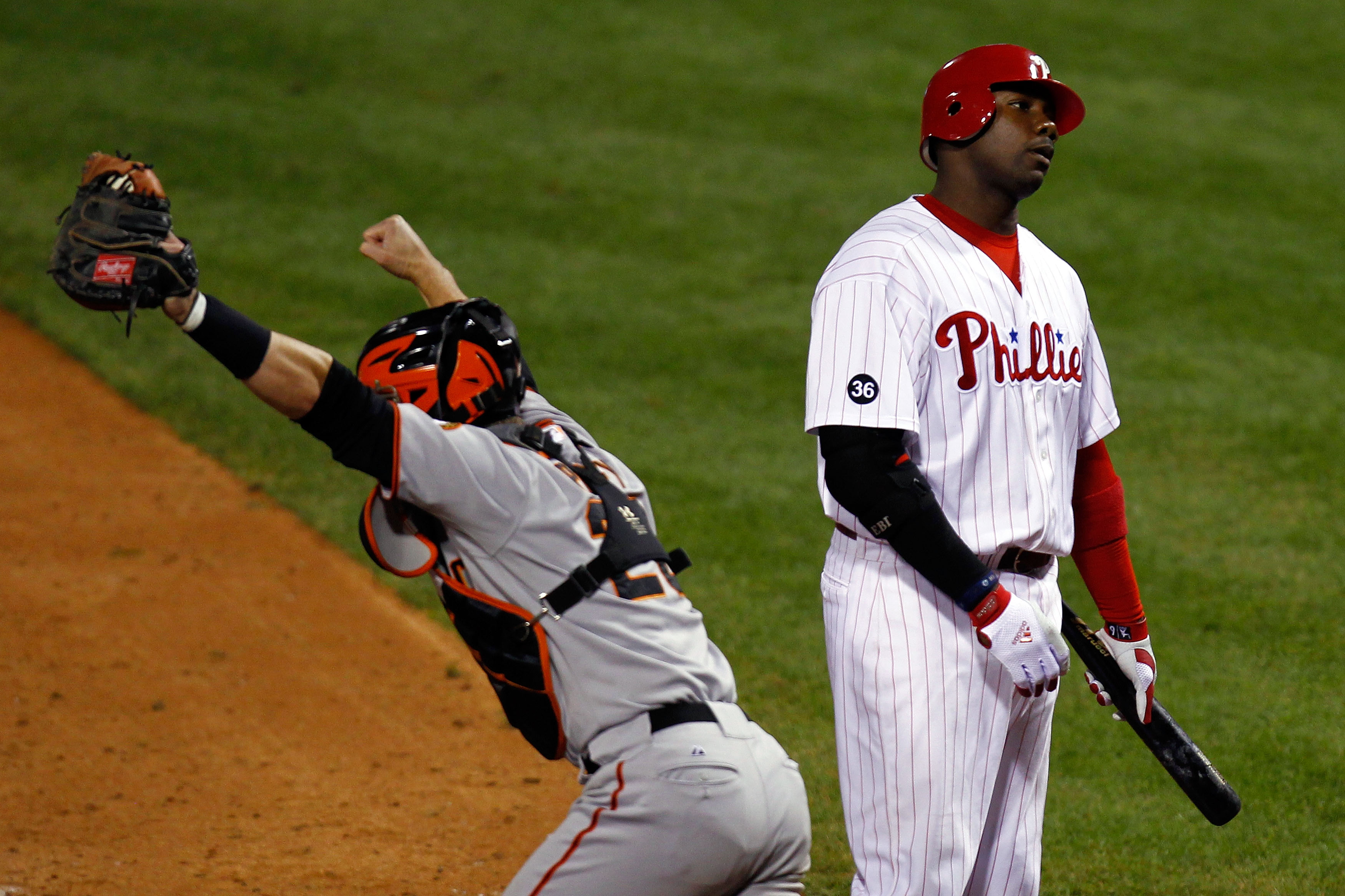 PHILADELPHIA - OCTOBER 23:  Ryan Howard #6 of the Philadelphia Phillies strikes out to end the game and lose as Buster Posey #25 of the San Francisco Giants celebrates in Game Six of the NLCS during the 2010 MLB Playoffs at Citizens Bank Park on October 2