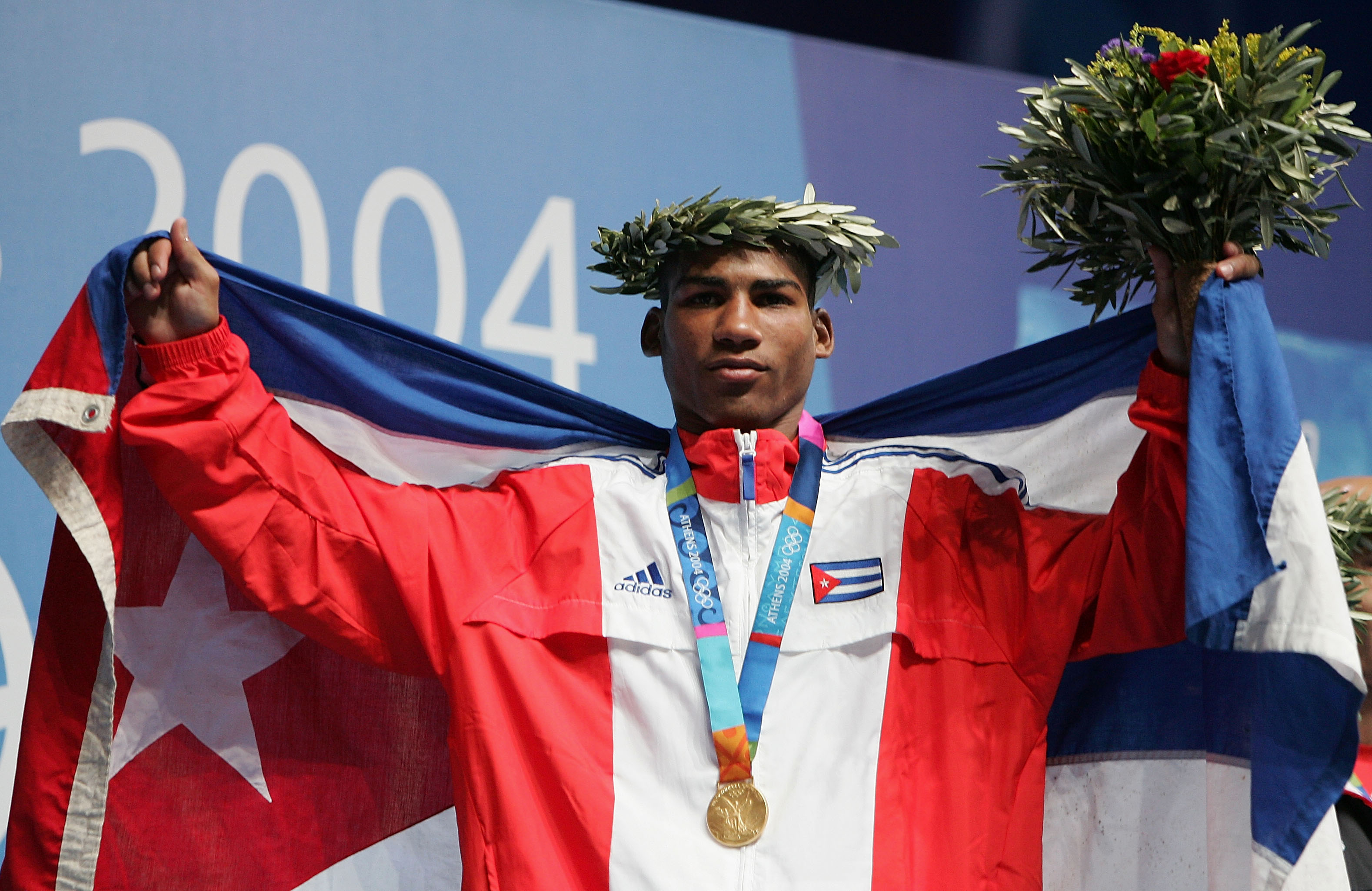 ATHENS - AUGUST 28:  Yuriorkis Gamboa Toledano of Cuba, Gold medalist in the men's boxing 51 kg event on August 28, 2004 during the Athens 2004 Summer Olympic Games at Peristeri Olympic Boxing Hall in Athens, Greece. (Photo by Al Bello/Getty Images)