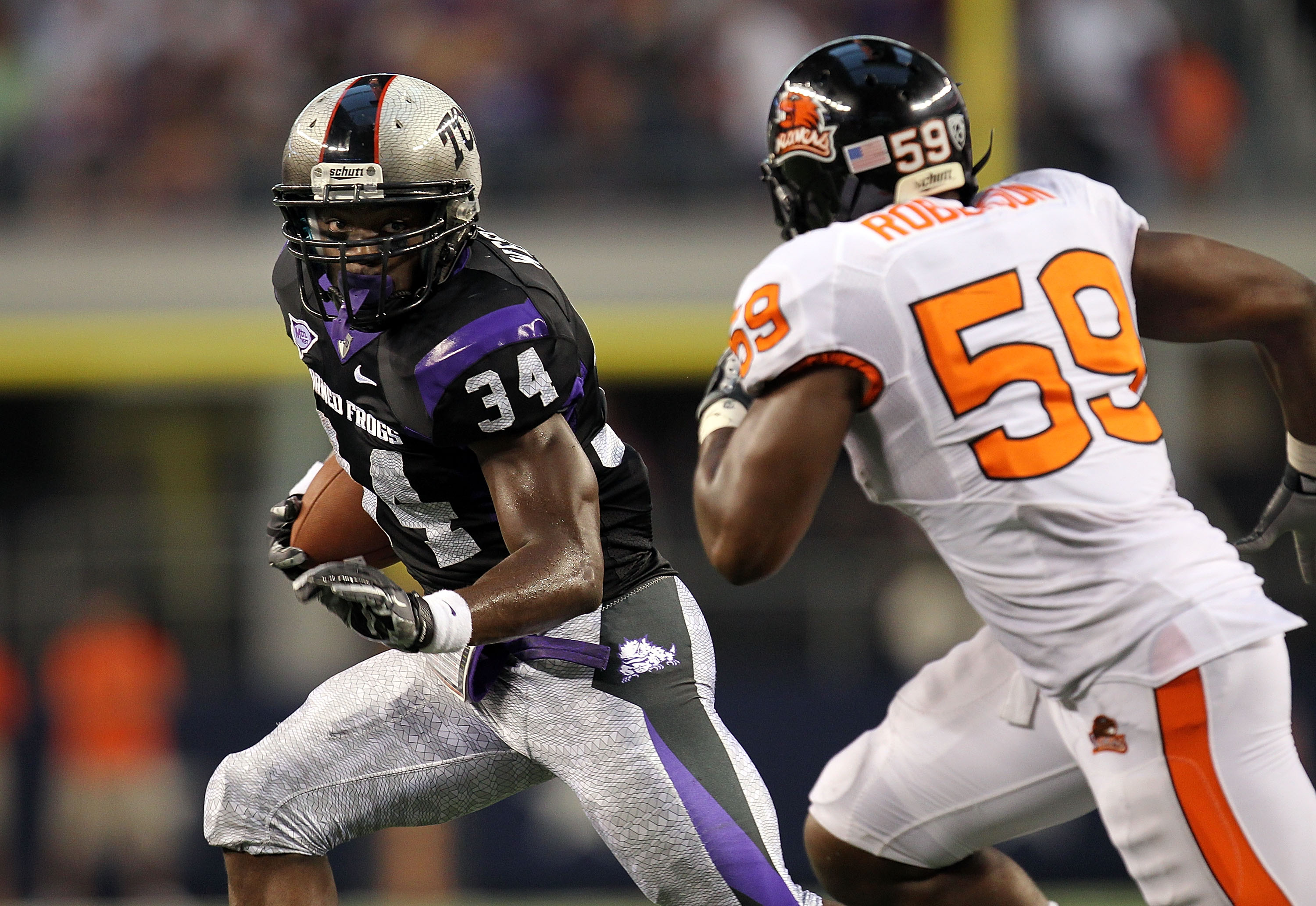 ARLINGTON, TX - SEPTEMBER 04: Tailback Ed Wesley #34 of the TCU Horned Frogs runs the ball against the Oregon State Beavers at Cowboys Stadium on September 4, 2010 in Arlington, Texas. (Photo by Ronald Martinez/Getty Images)